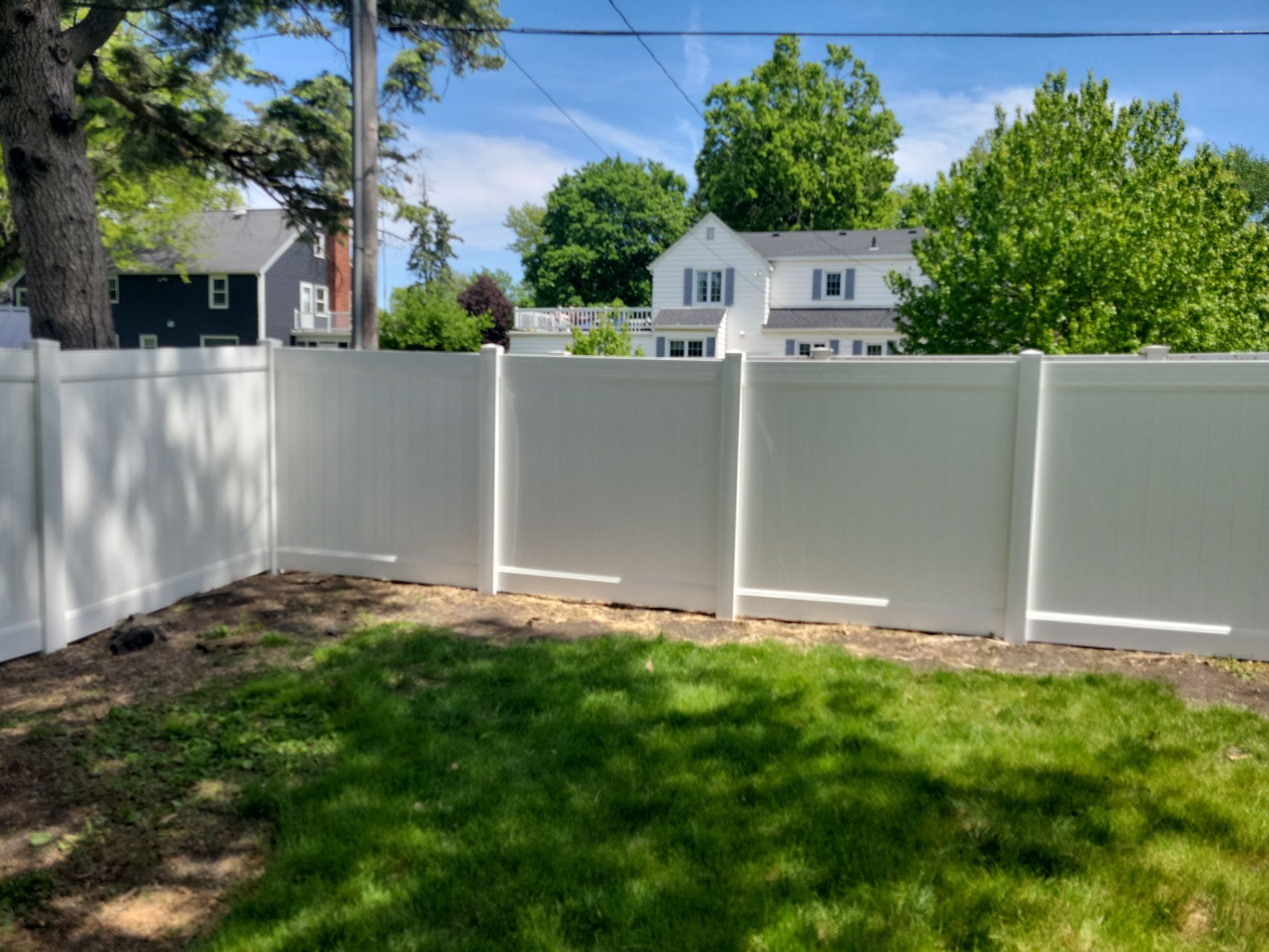 Residential White Vinyl Privacy Fence Installation in Waterloo by Perfect Picket Fence and Stain