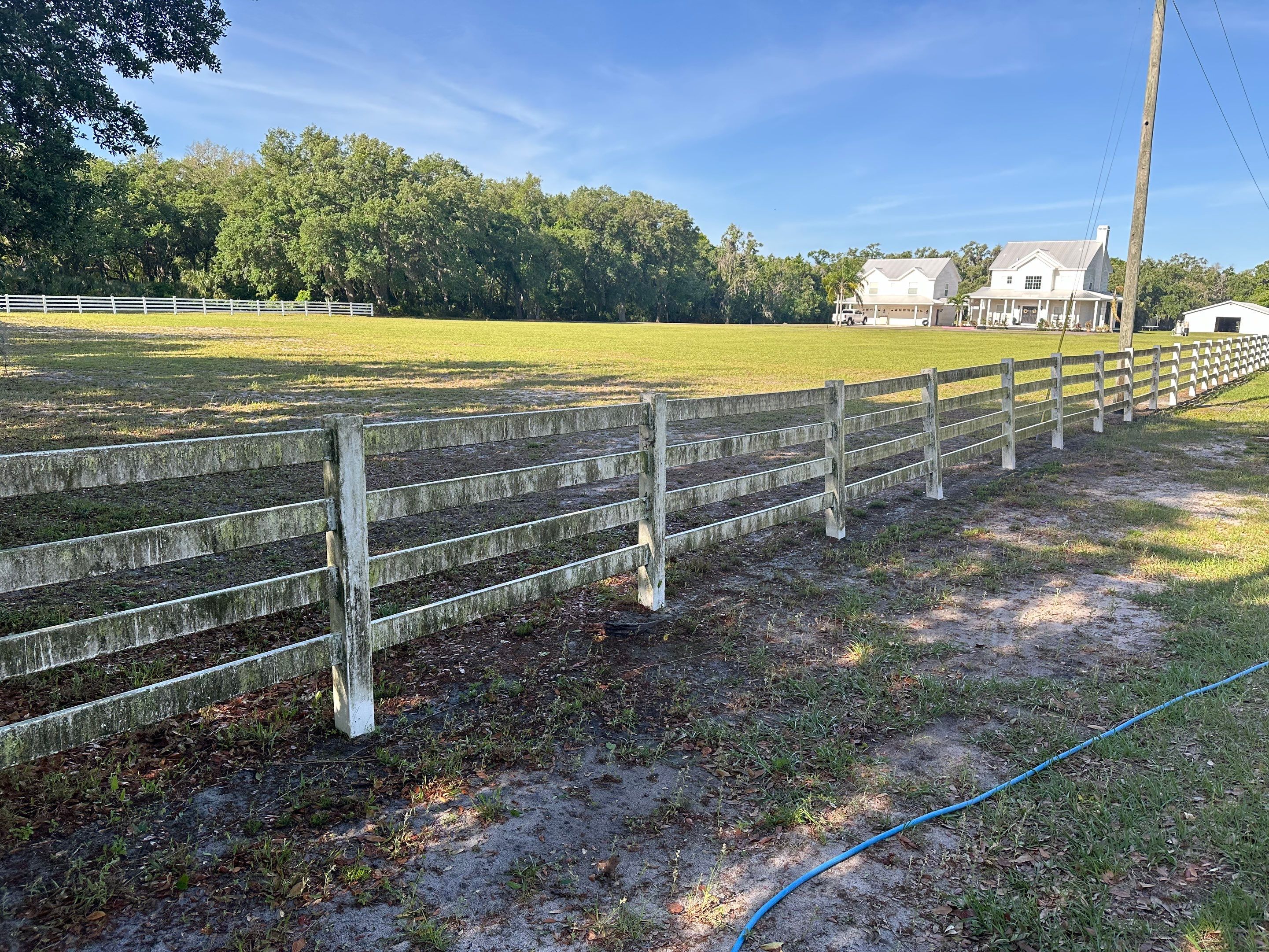 Vinyl Horse Fence & Concrete Pier Cleaning at Lesley Cox Equestrian, Parrish, FL | Sunshine AquaWash by Sunshine AquaWash