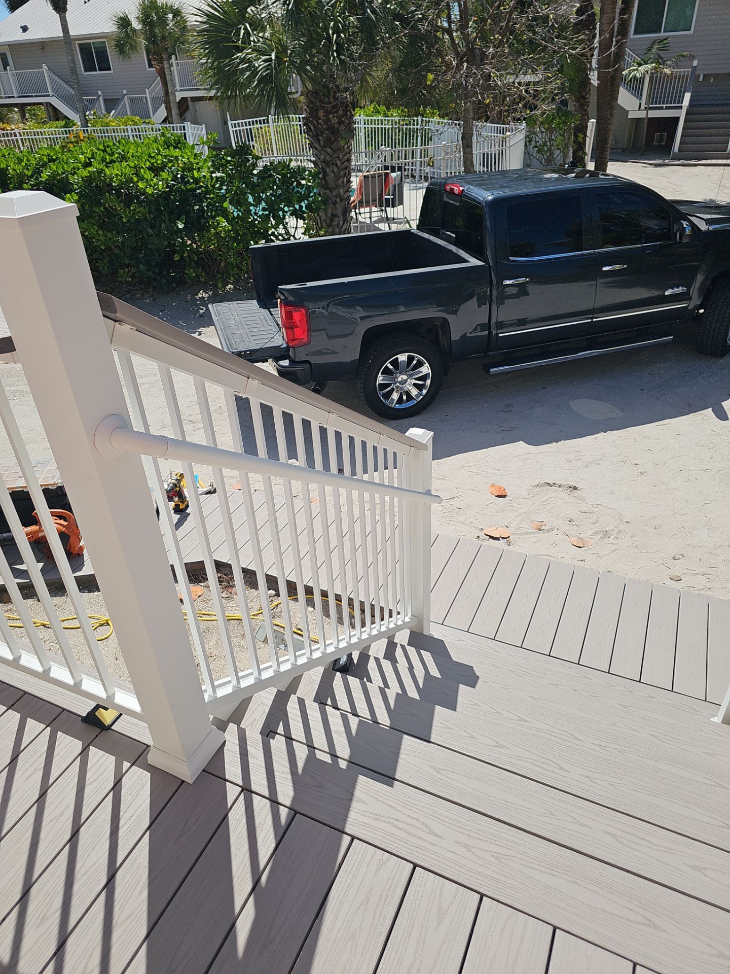 Elevated Composite Deck and Symmetrical Staircase Replacement in Englewood by Smirnov Construction Inc