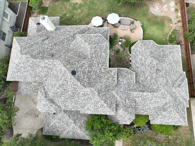 Residential Roof Replacement using 30 Year Laminate Shingles with High Profile Ridge