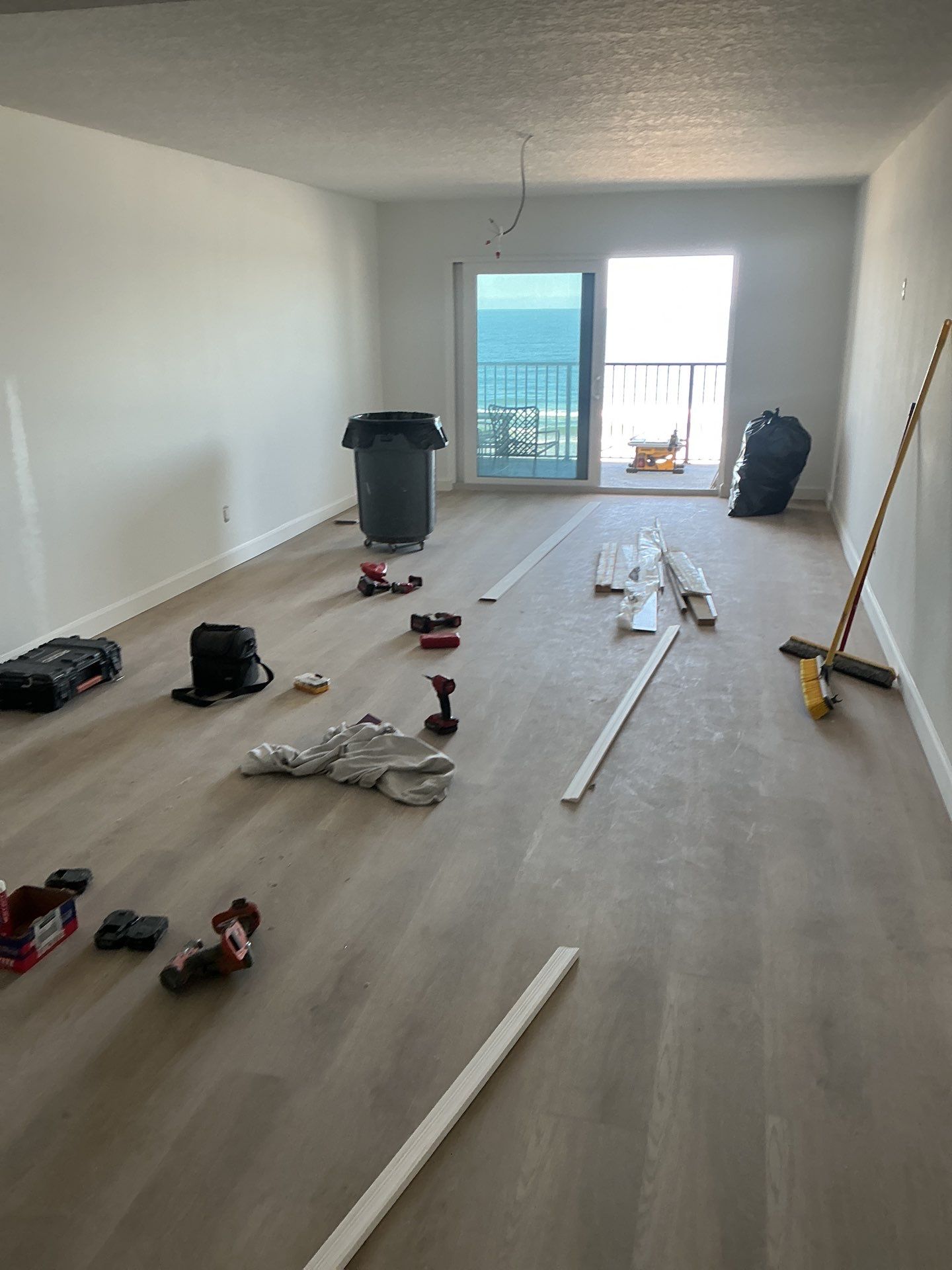 Full Condominium Remodel Featuring Aubrey Oak Flooring In Daytona Beach by Acies Renovations
