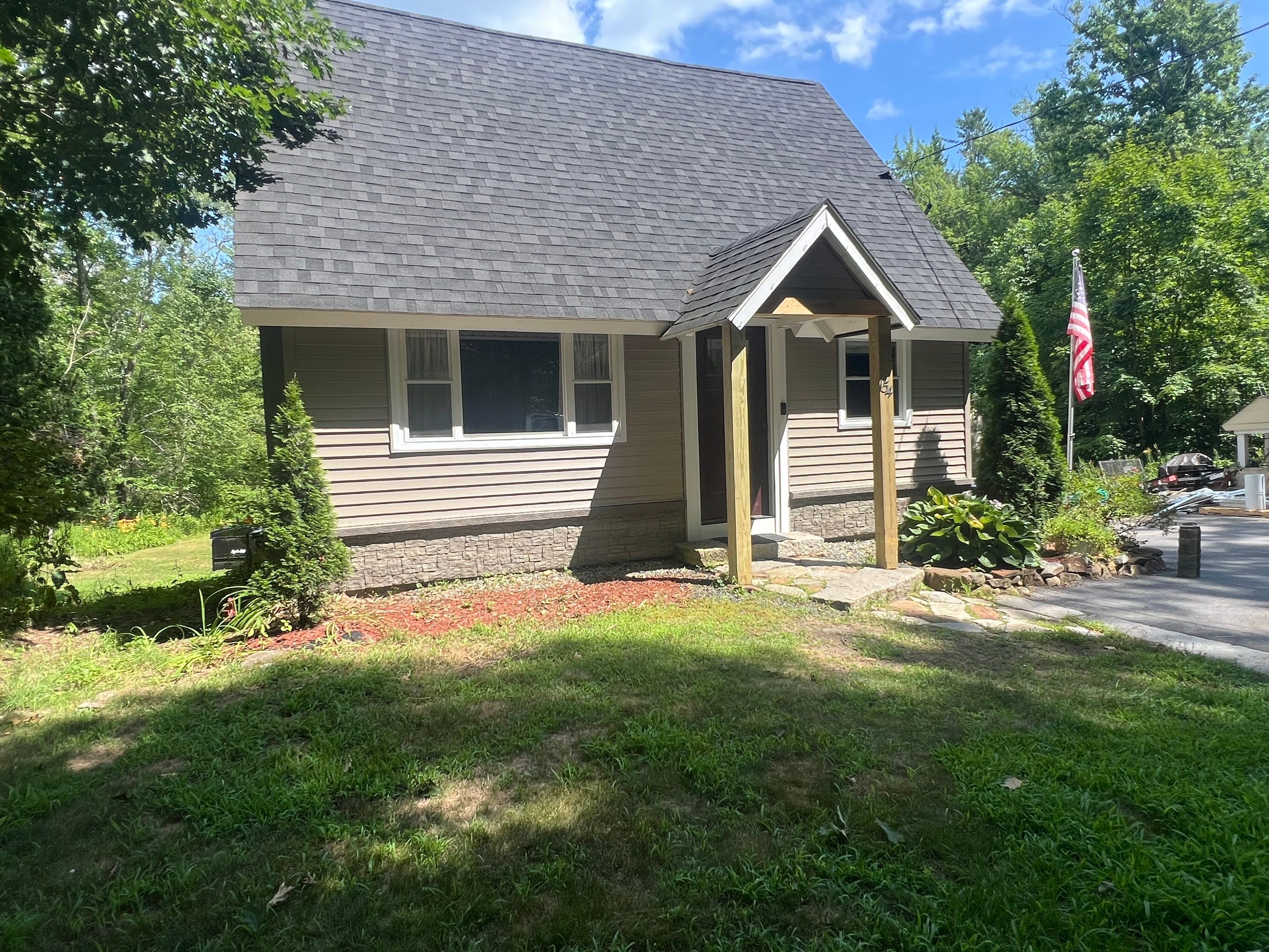 Weare, NH – TandoStone® Stone Facade Installation by Tall pine roofing