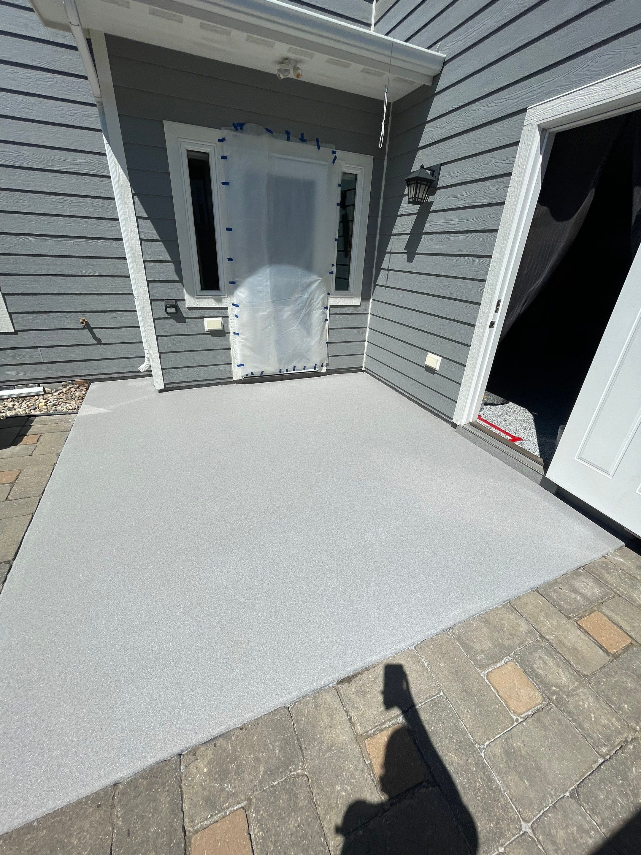 Concrete Patio Coating with Fuzzy Wool Finish in Sioux Falls by Select Painting, Coatings & Garage Cabinets