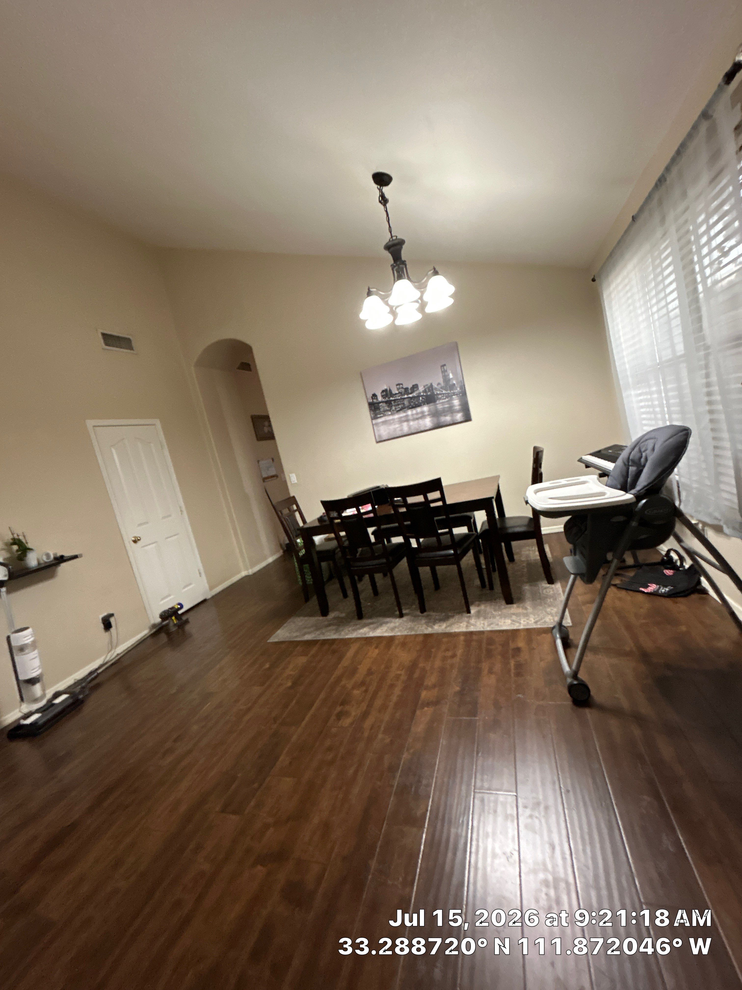 Dark Wood Laminate Flooring Installation for Chandler Dining Room by CompanyCam Sales Demo