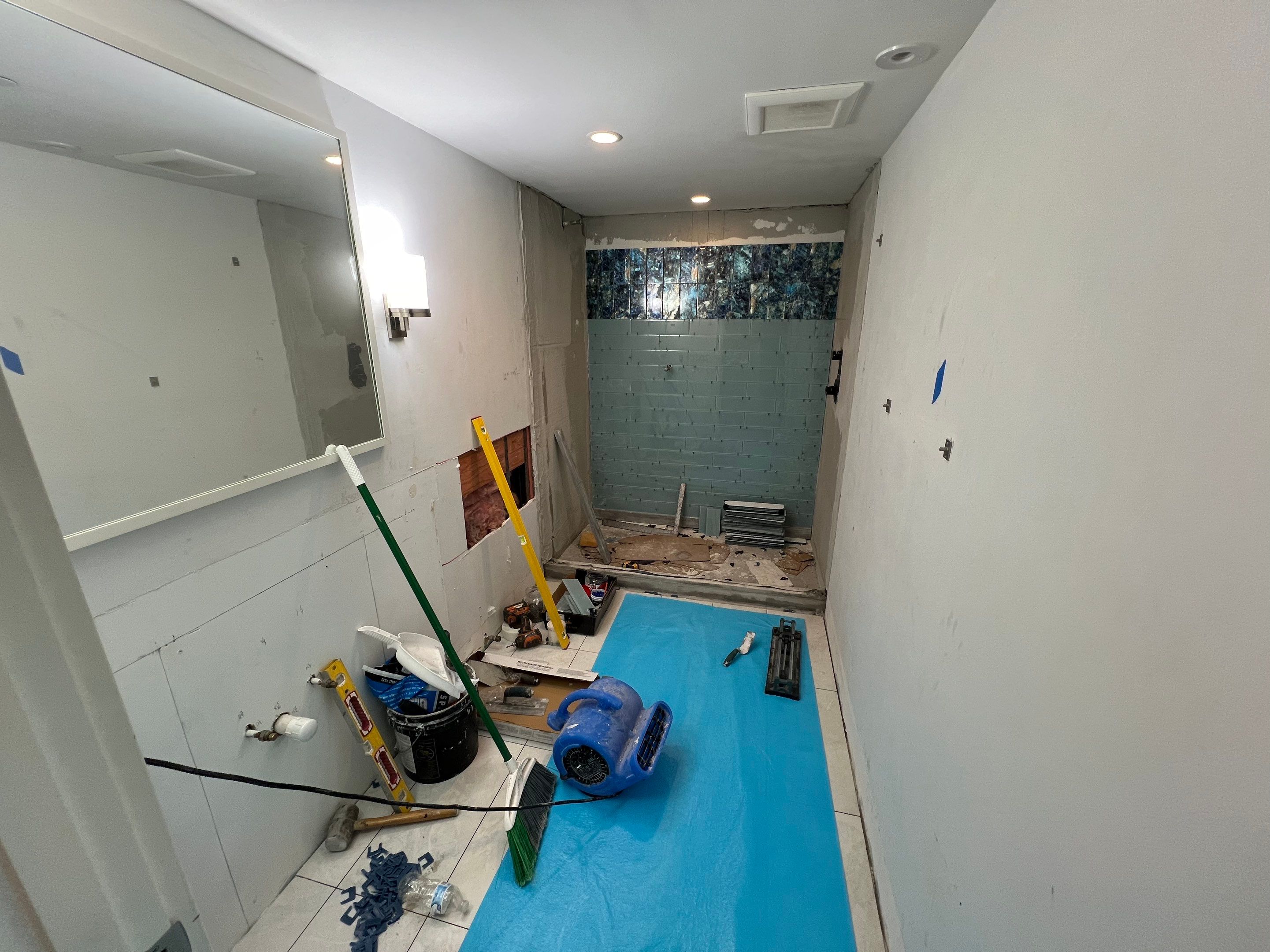 High-Rise Bathroom Remodel by Naples Flooring Boutique