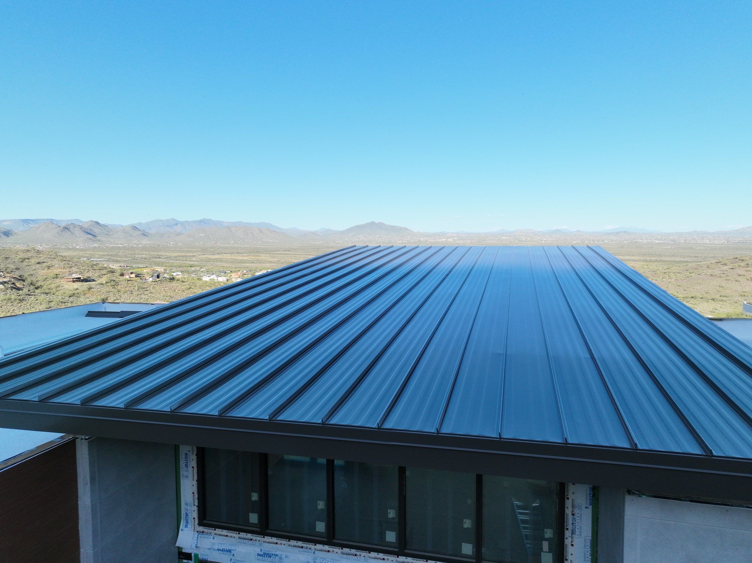 Dark Bronze Standing Seam by Reimagine Roofing