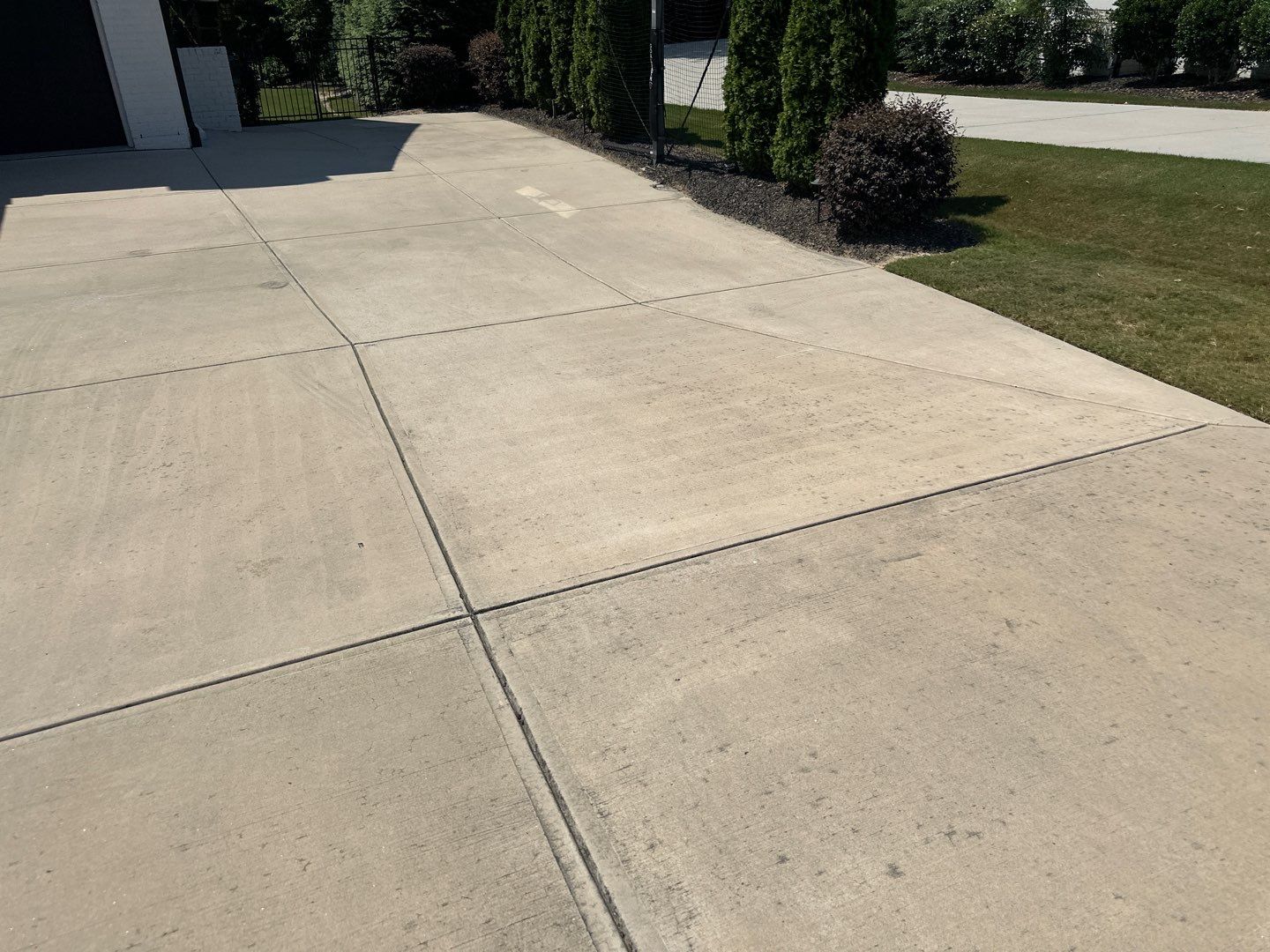 Concrete Driveway, Wood Playset using Wood Sealant and Concrete Sealant by DuraSeal