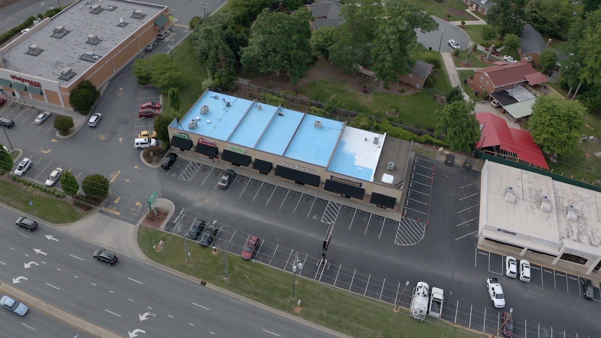 Commercial Roof Coating using Fiberseal basecoat and Silicon Topcoat by Just In Time Roofing and Restoration
