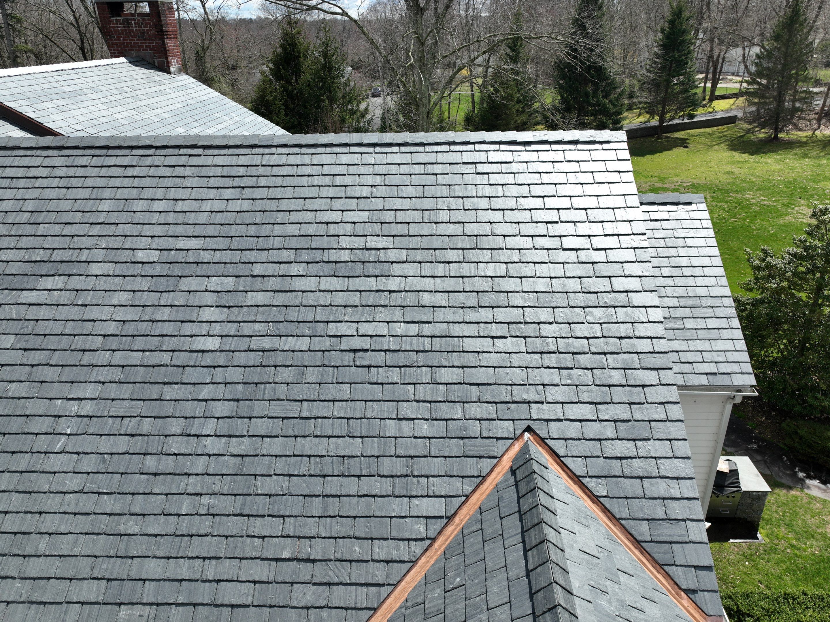Residential Roofing Installation using Vermont Slate by A Plus Exterior