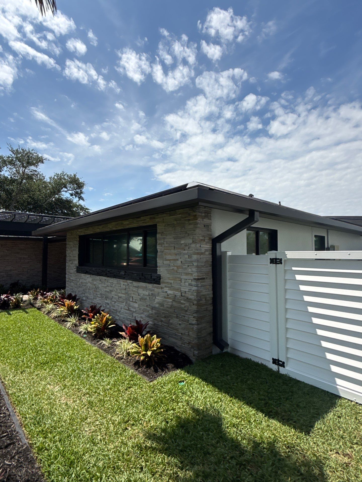 7-Inch Smooth Box Seamless Gutters using black seamless gutters in Siesta Key Fl by Gutter Professors