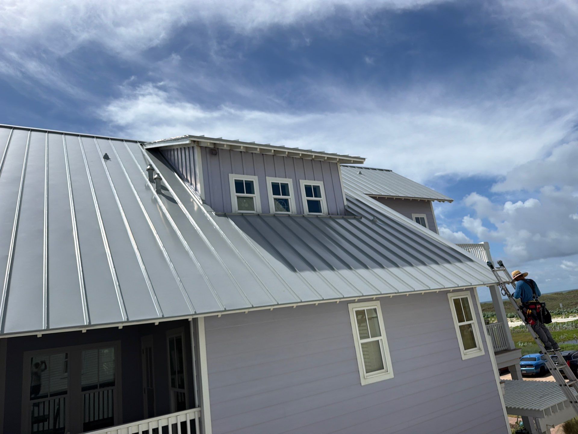 Residential Roof Replacement using .032 Standing Seam Doublelock - Aluminum by Action Exteriors Austin