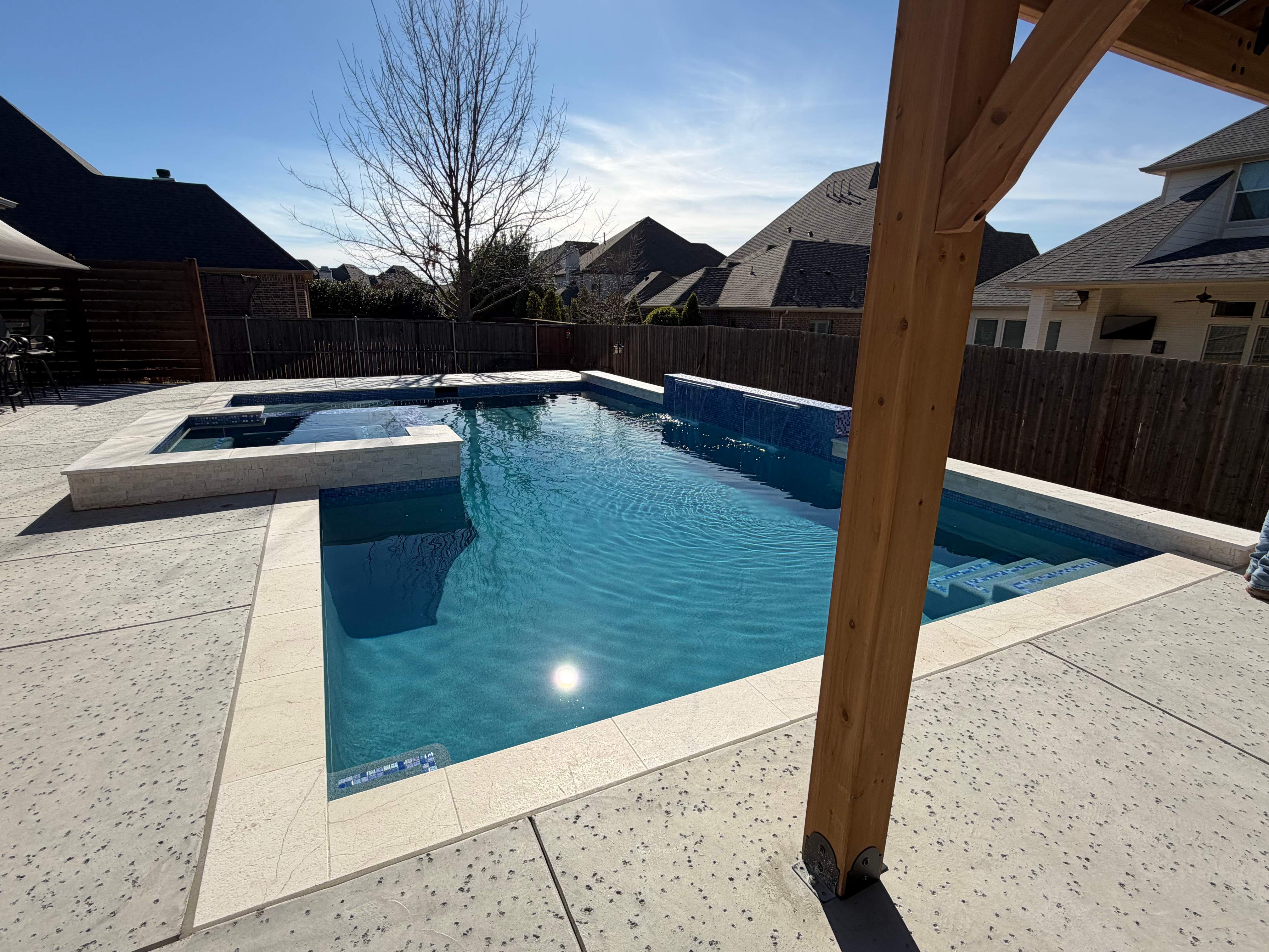 Geometric Pool with Raised Spa and Tanning Ledge by Pinnacle Pools and Spas - DFW