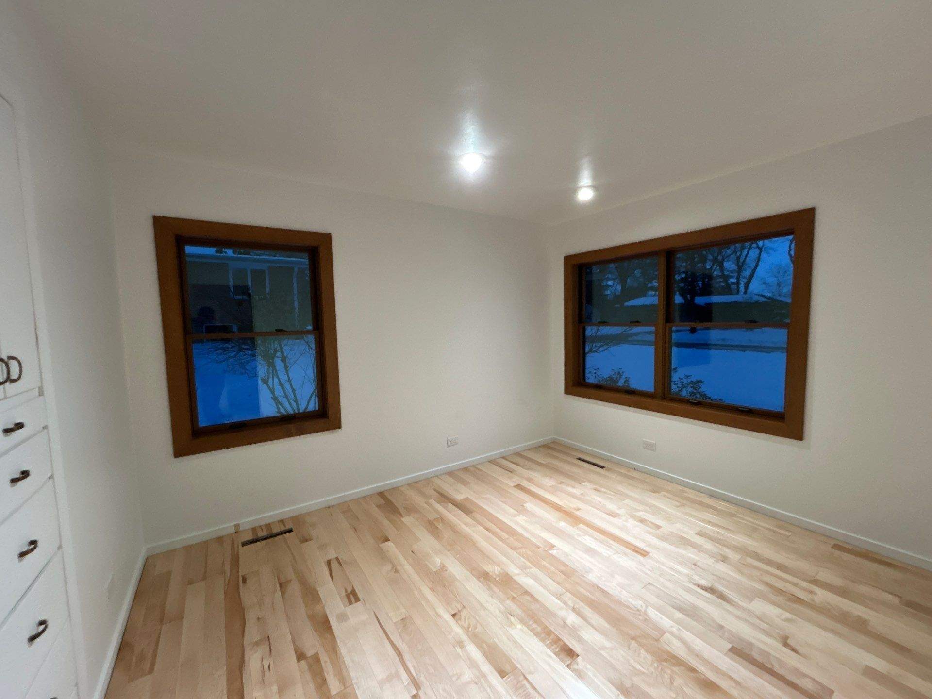 Black-Frame Pella Lifestyle Upgrade on a Partial Brick Home by United Windows and Siding LLC