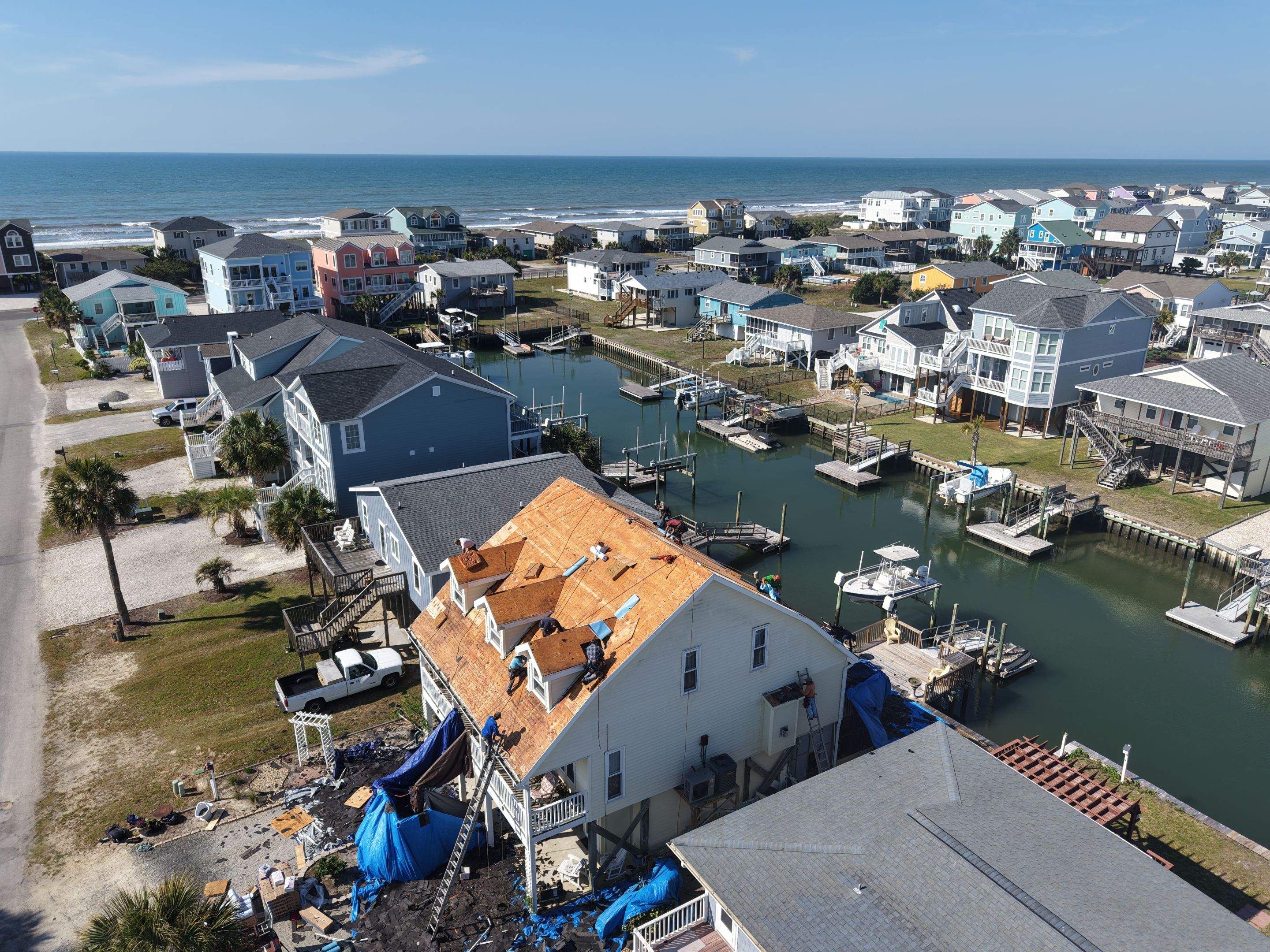 Holden Beach Canal-Side FORTIFIED Roof Replacement with Coastal Blue Shingles by RGR Construction and Roofing, LLC