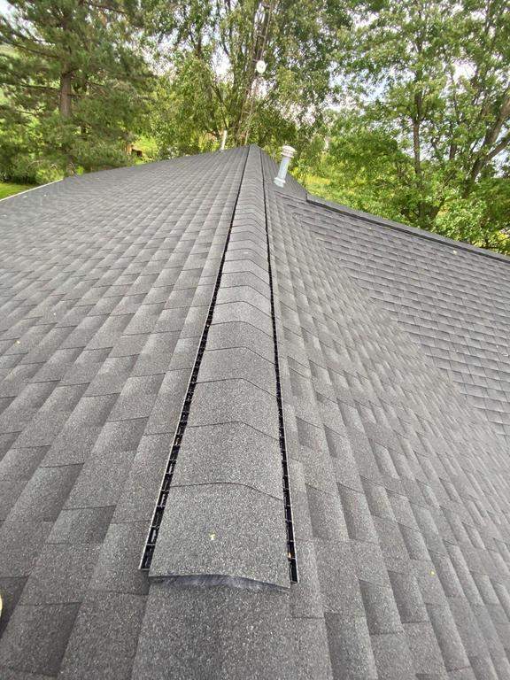 Storm damage roof replacement by Nitro Roofing and Construction