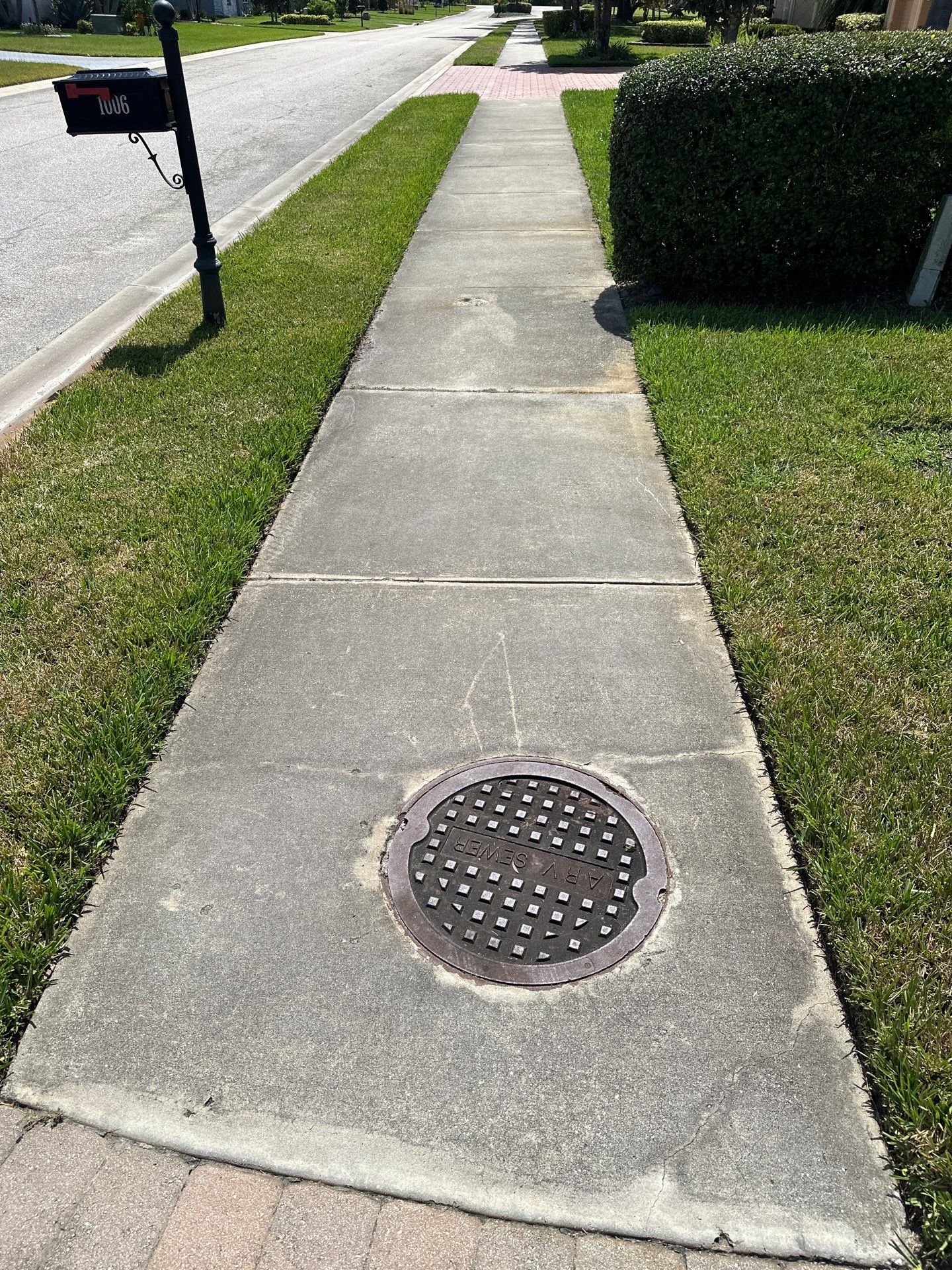 Paver Driveway, Entryway, Sidewalk, and Street Curbing Cleaning in Winding River Community, Bradenton, FL by Sunshine AquaWash