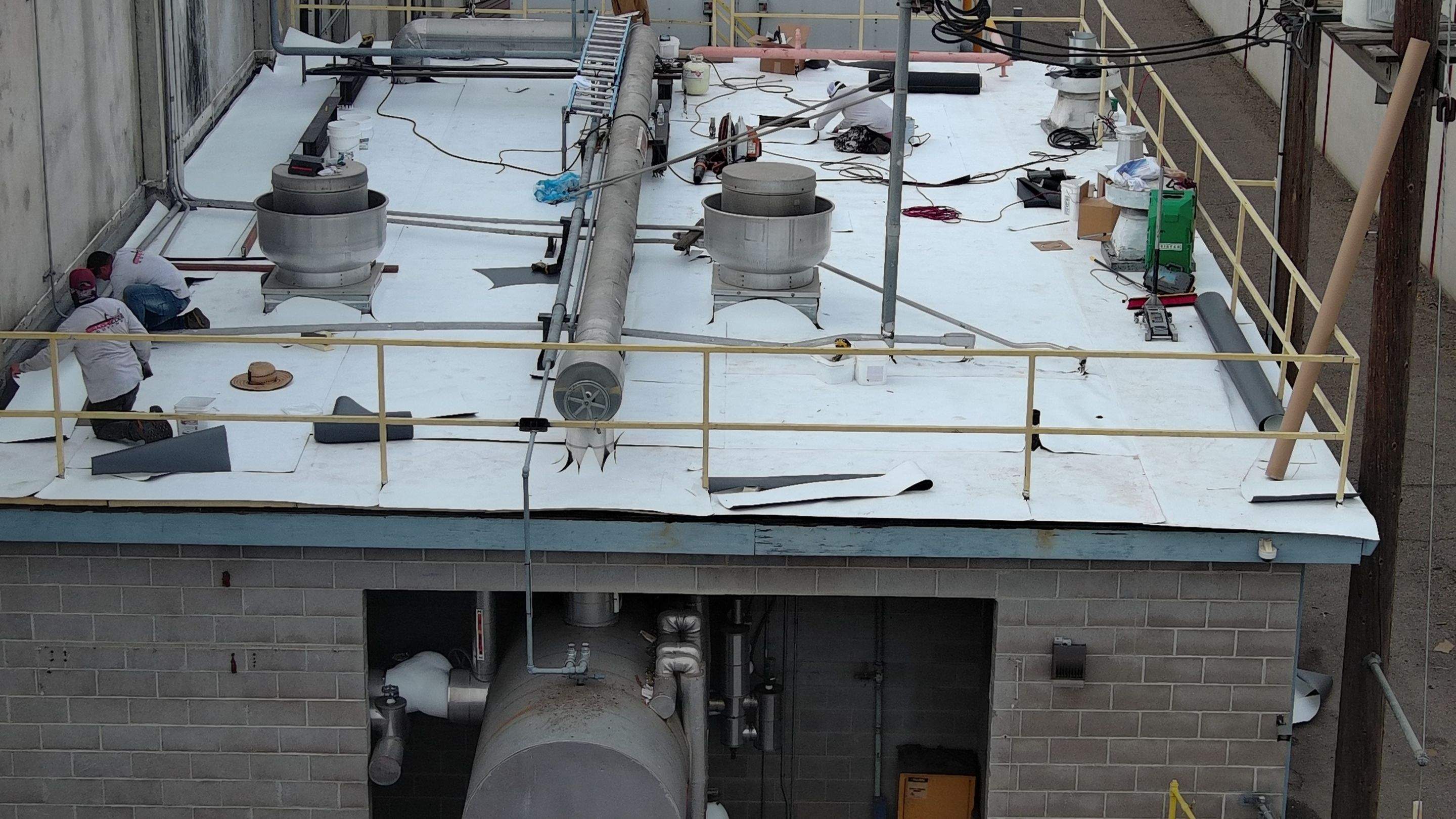 TPO single-ply roofing system using GAF Single-ply TPO 60 mil with 1.5 inch ISO board insulation by Straight Edge Roofing Inc