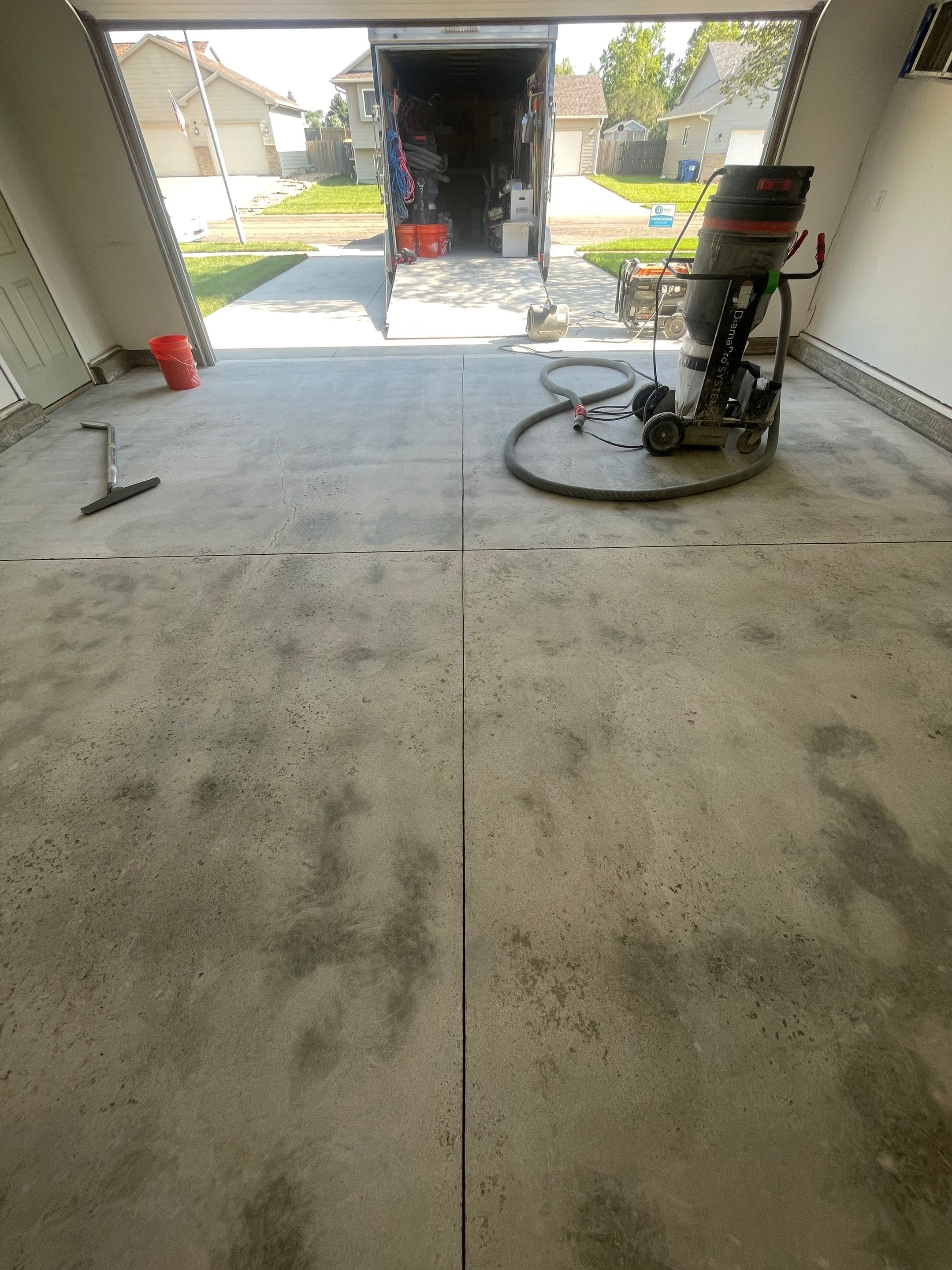 Sioux Falls Garage Floor Coating with Nightfall Decorative Chips by Select Painting, Coatings & Garage Cabinets