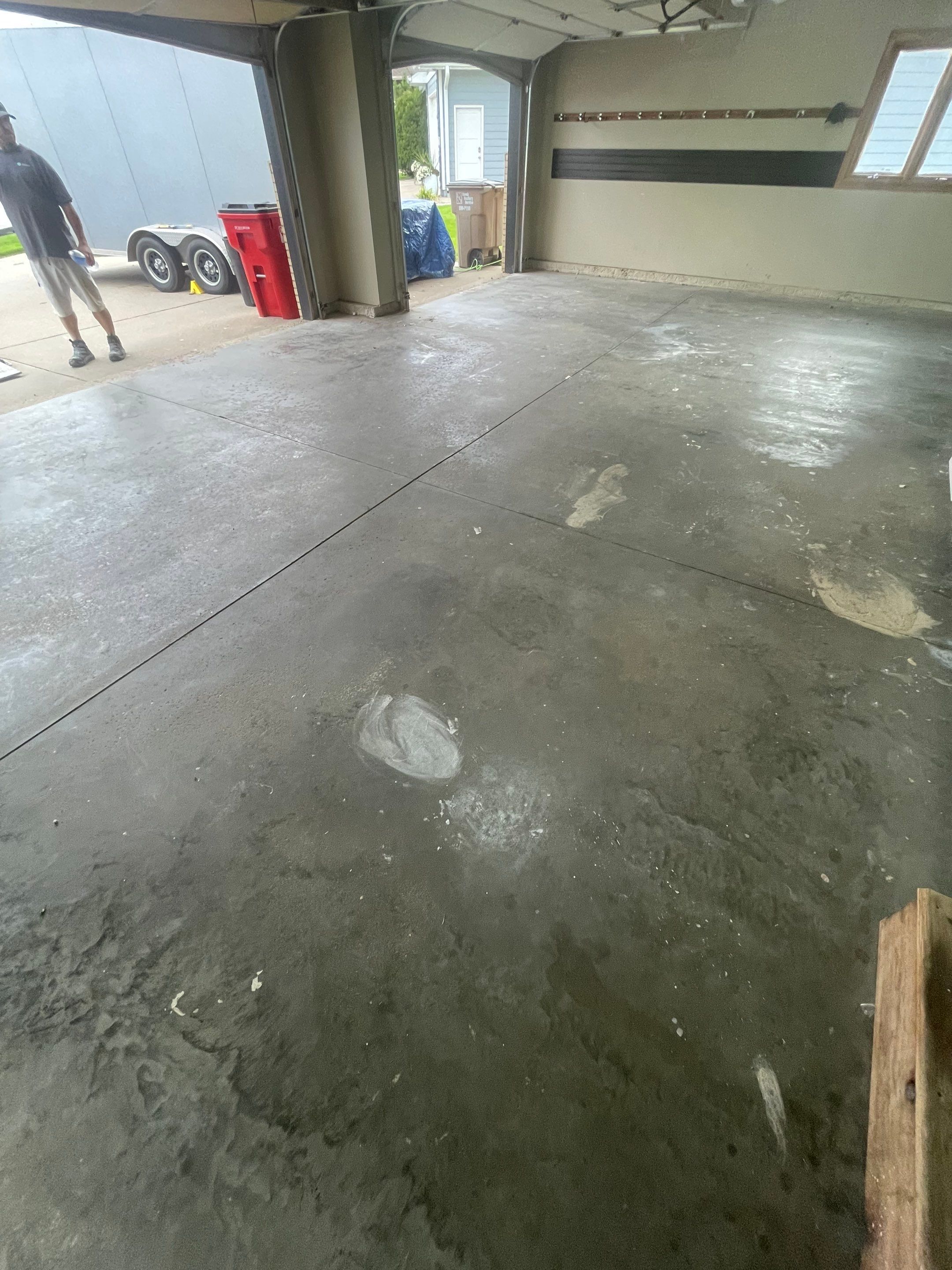 Cabin FEver Flake Garage Floor Coating Installation in Sioux Falls by Select Painting, Coatings & Garage Cabinets