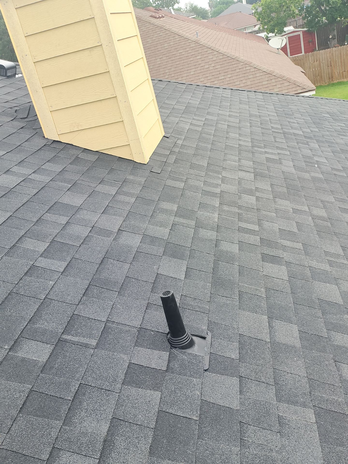 Nothing looks nicer than a little black roof by Bayfront Roofing and Construction