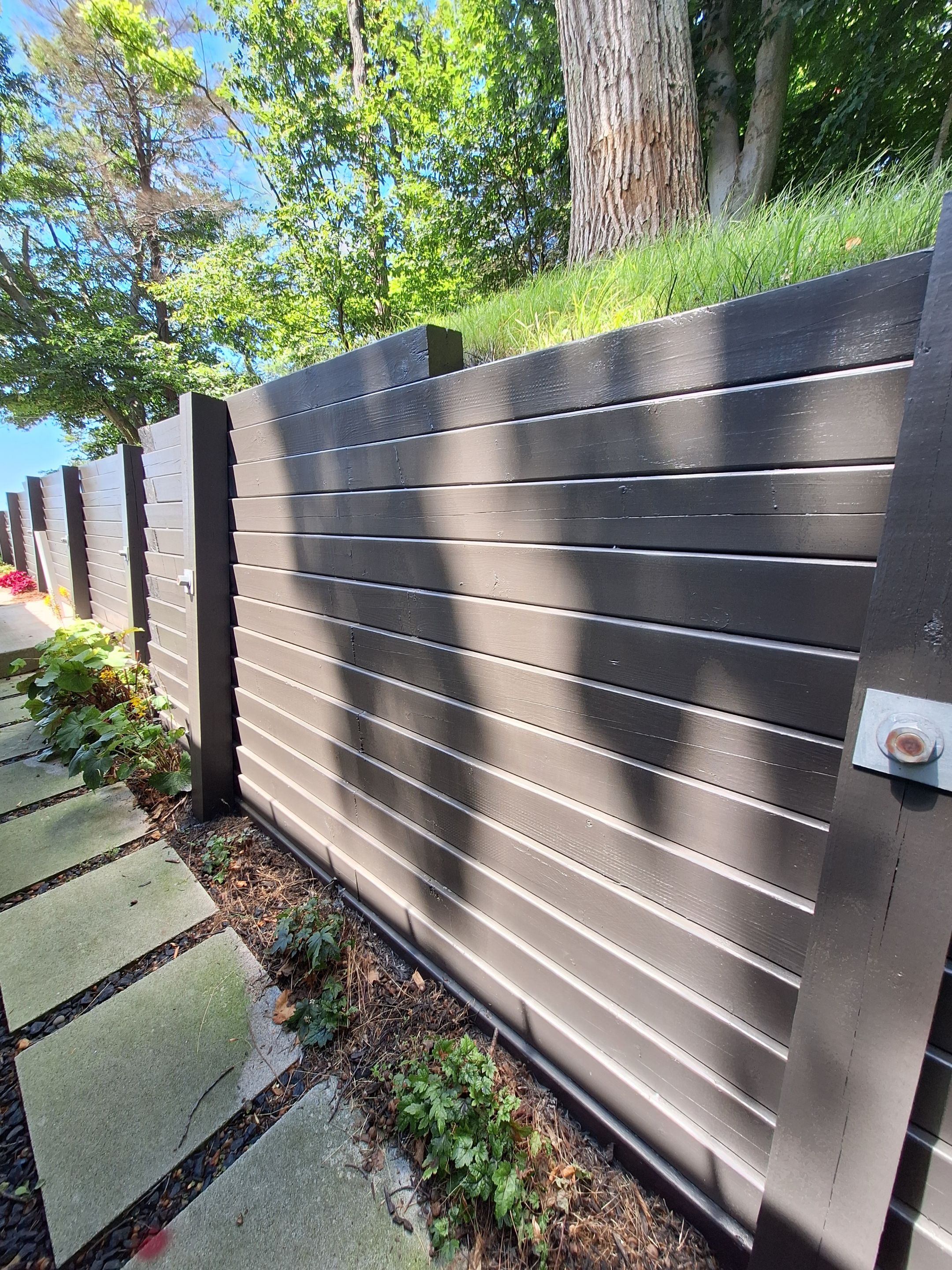 Exterior Retaining Wall Painting | Grand Haven, Michigan by Gordon Painting