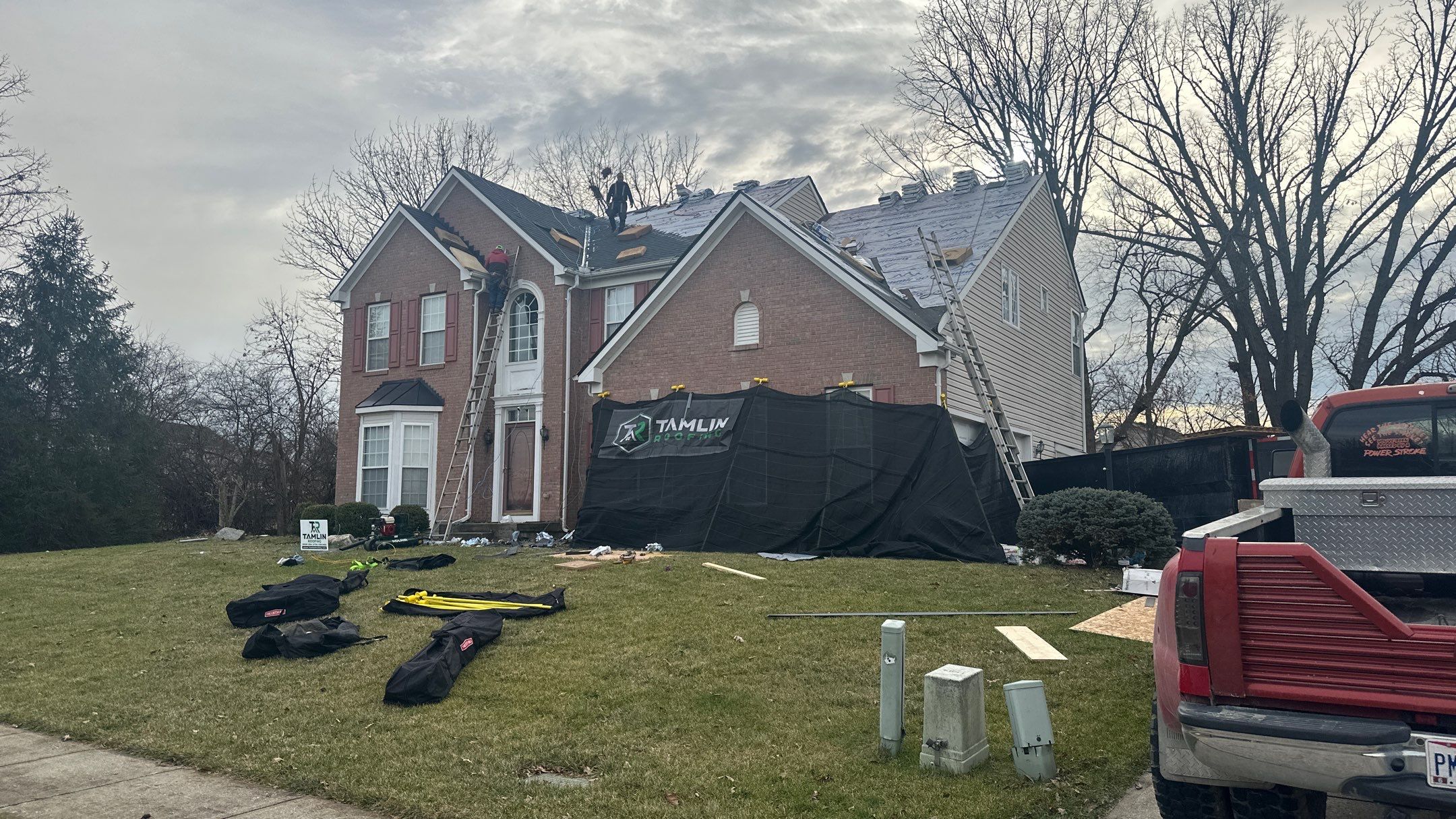 Walden Ponds - Pristine Black and Hydro Flo Gutter Guards by Tamlin Roofing