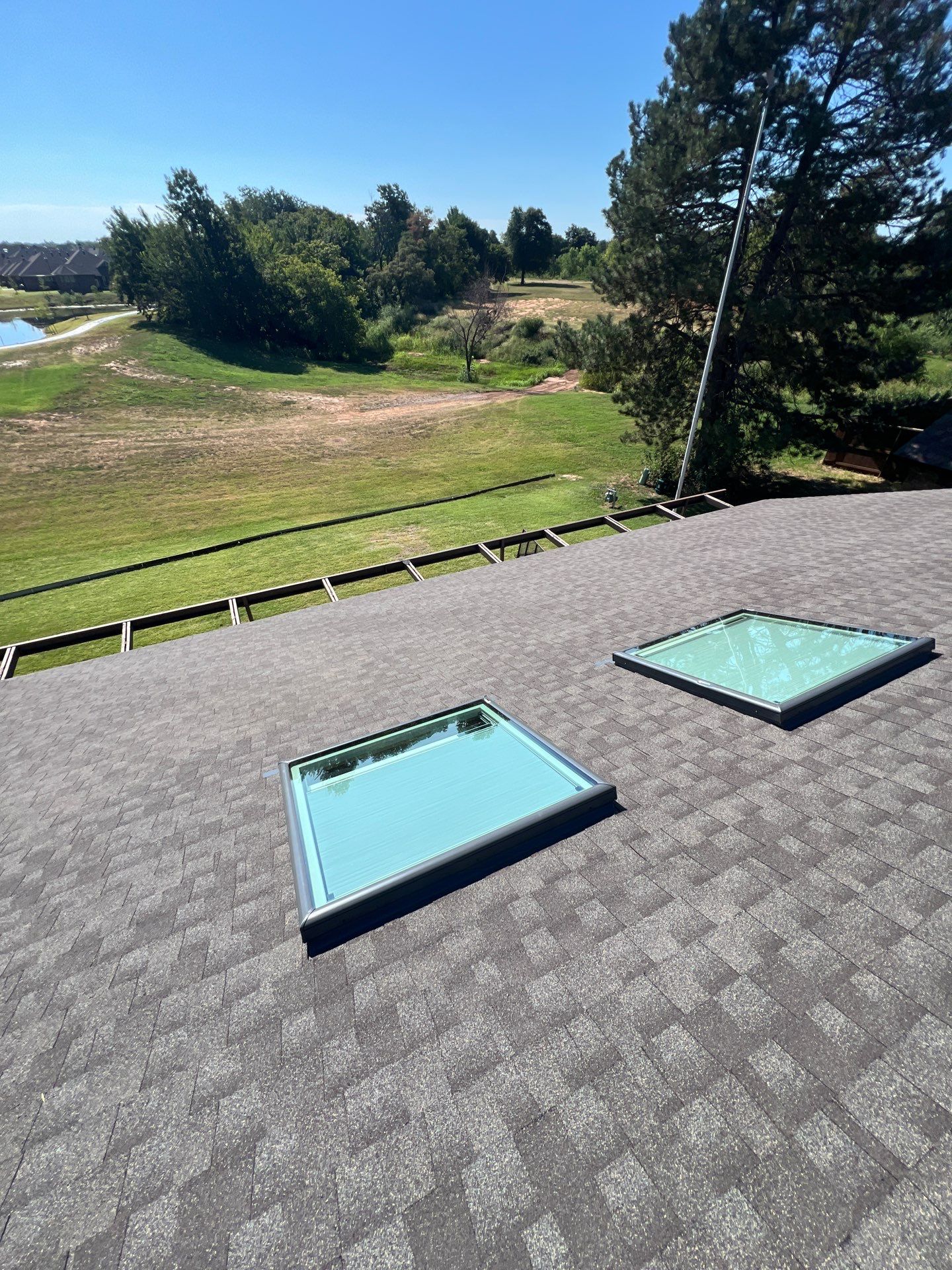 Roof Replacement and Skylight Replacement in Yukon by McCann's Roofing and Construction