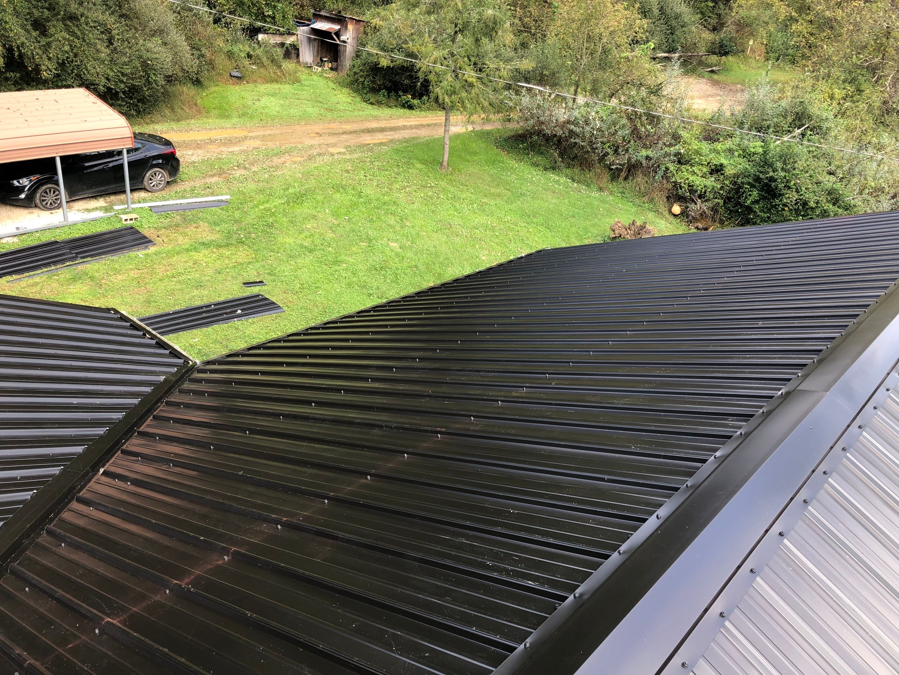 Metal Roof and Vinyl Siding, Soffit, Gutters using LifeTite Premium metal roofing  by Secure Construction Company Inc