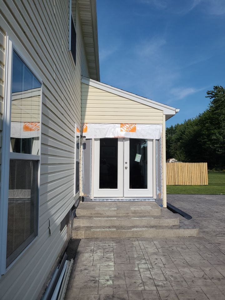 Stamped Concrete, Entry Door, and Concrete  by Ivy Lea Construction