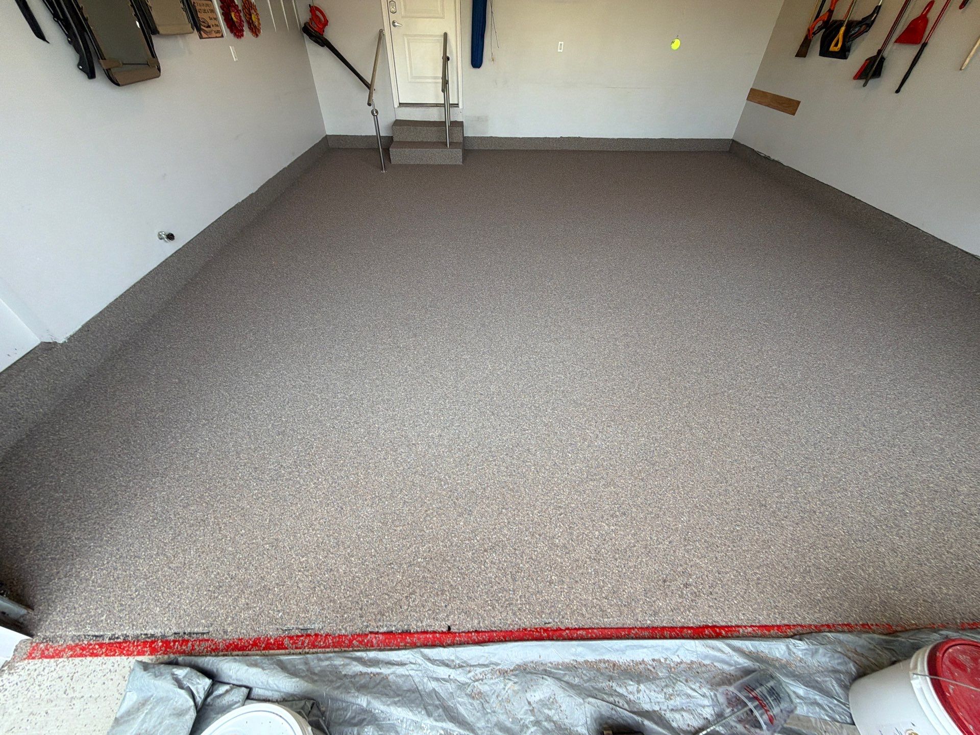 Garnet Polyaspartic Flake Garage Floor Installation in Zeeland by Gordon Painting