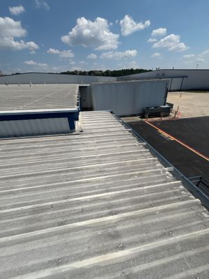 View of corrugated metal roof edge and building exterior