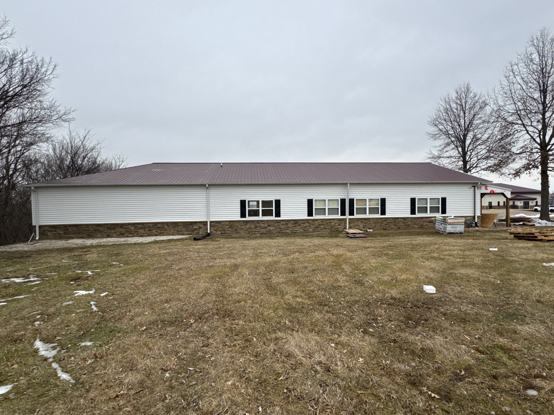 Siding and Stone Installation using Extrerior Porfolio Vinyl Siding and Versetta Stone by EEC  Windows, Siding & Roofing 