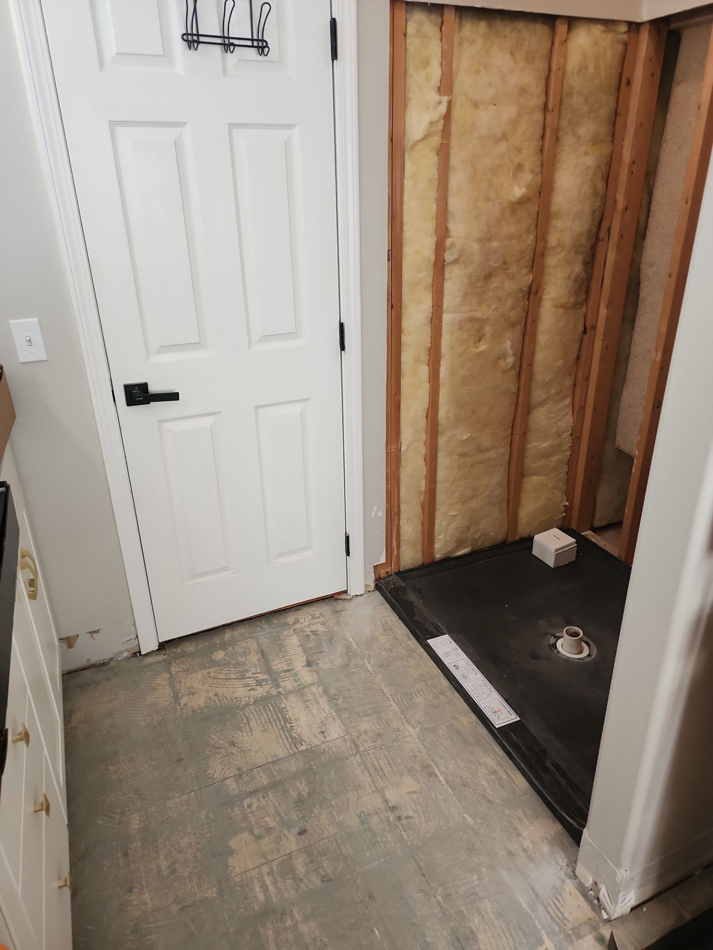 Master Bathroom Renovation Featuring Dark Textured Shower Panels in Branson West by Kitchen Works LLC