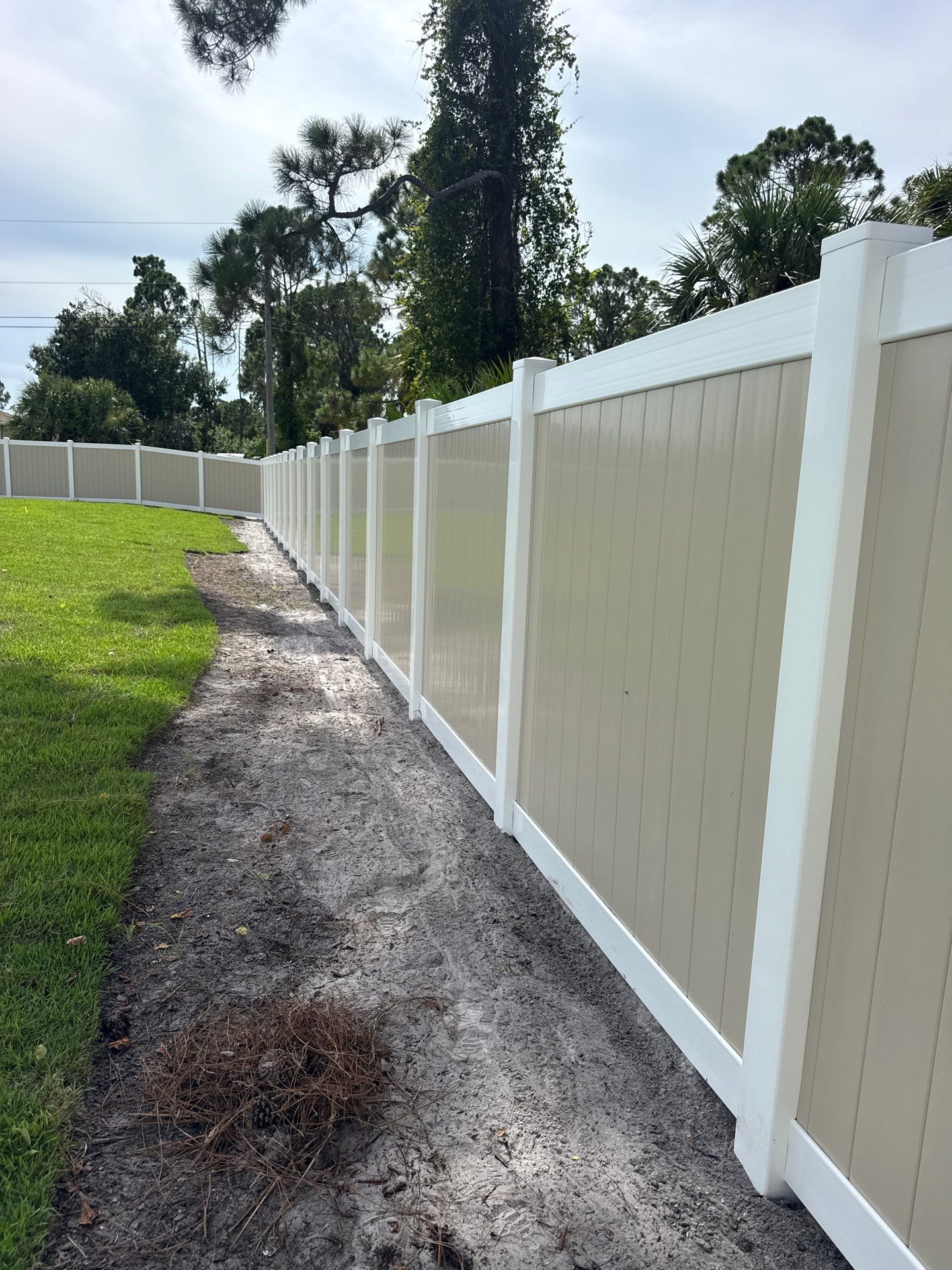 Custom Two-Tone Vinyl Privacy Fence Installation in North Port by True Fence LLC