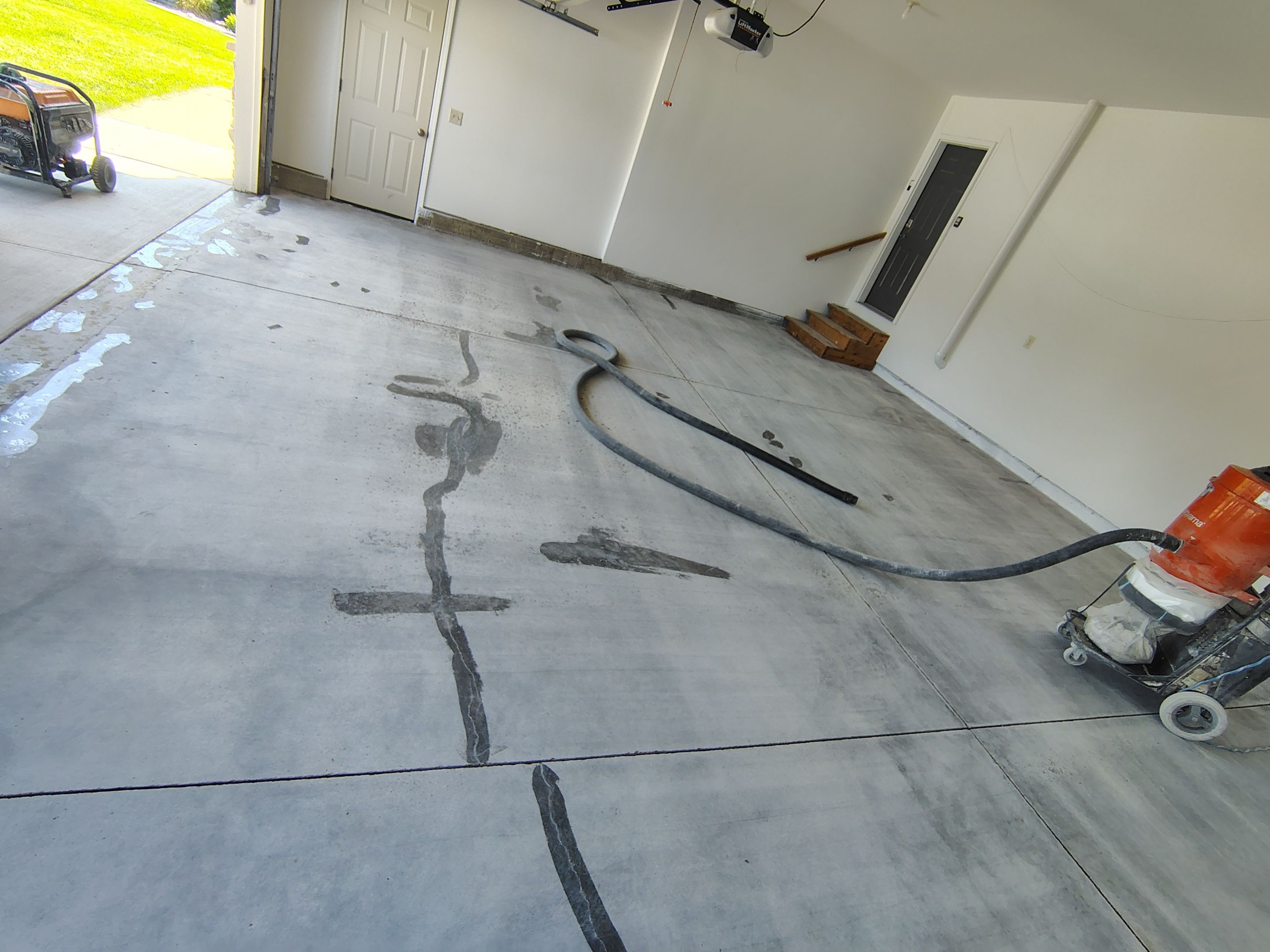 Custom Grey Speckled Epoxy Floor Coating for Sioux Falls Garage by Select Painting, Coatings & Garage Cabinets