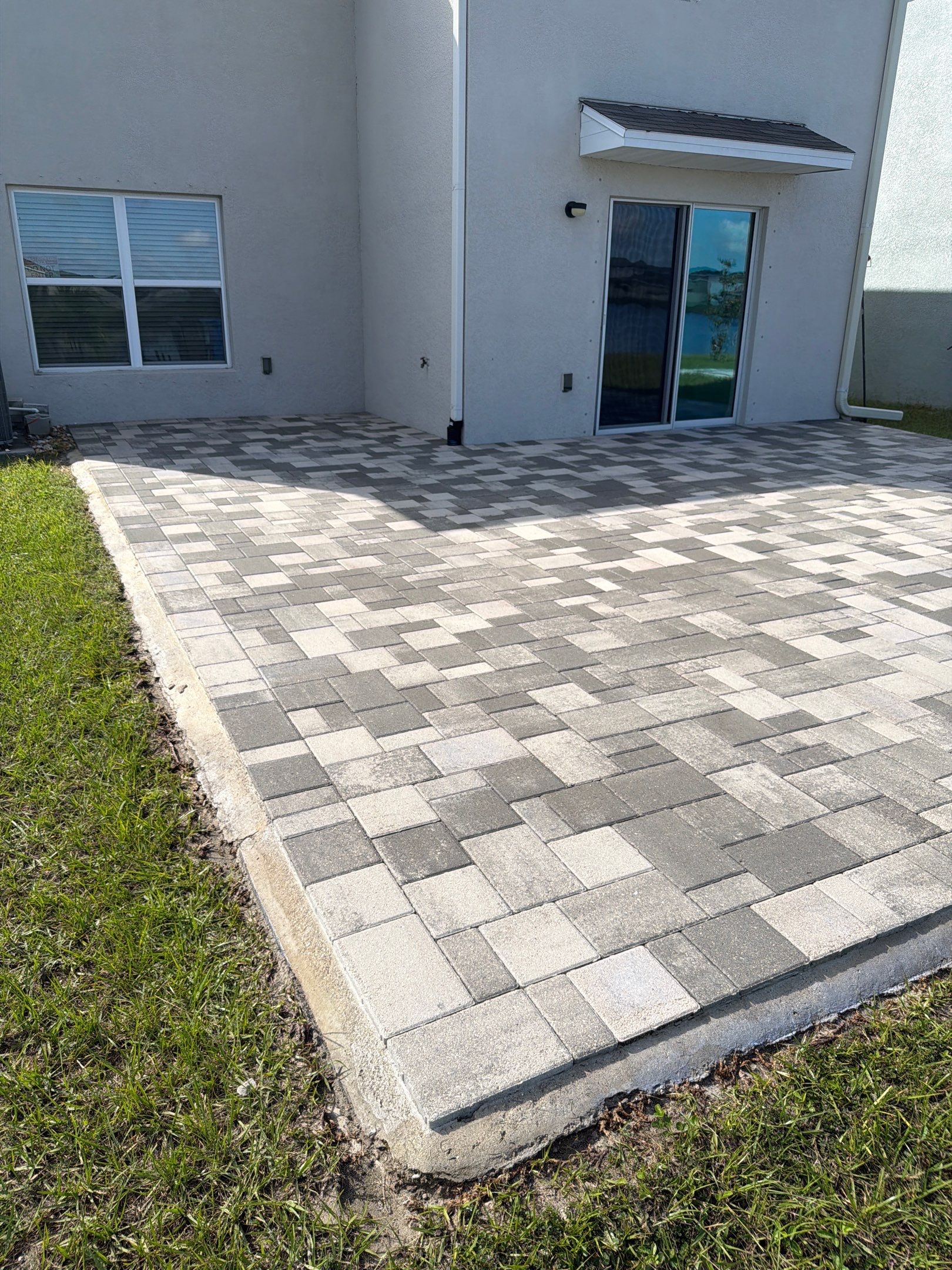 Paver Sealing and Restoration for Large Multi-Toned Patio in Wimauma by Supreme Paver Experts