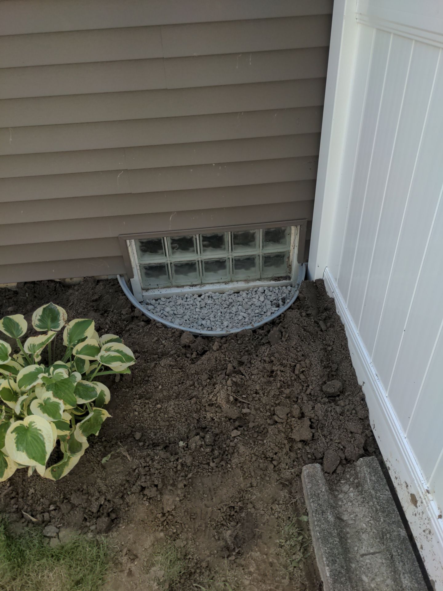 Interior Basement Waterproofing System and Egress Window Installation by Toledo Basement Repair 