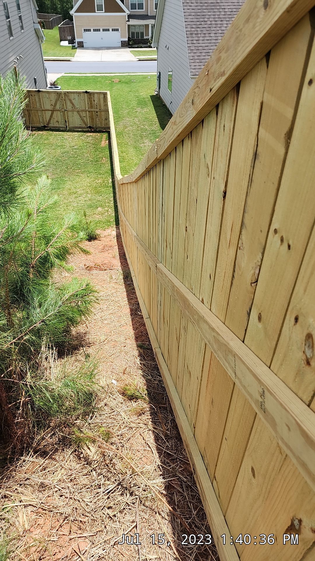 Fence Installation of Capped Wood Privacy by Titans of Timber Fence & Stain