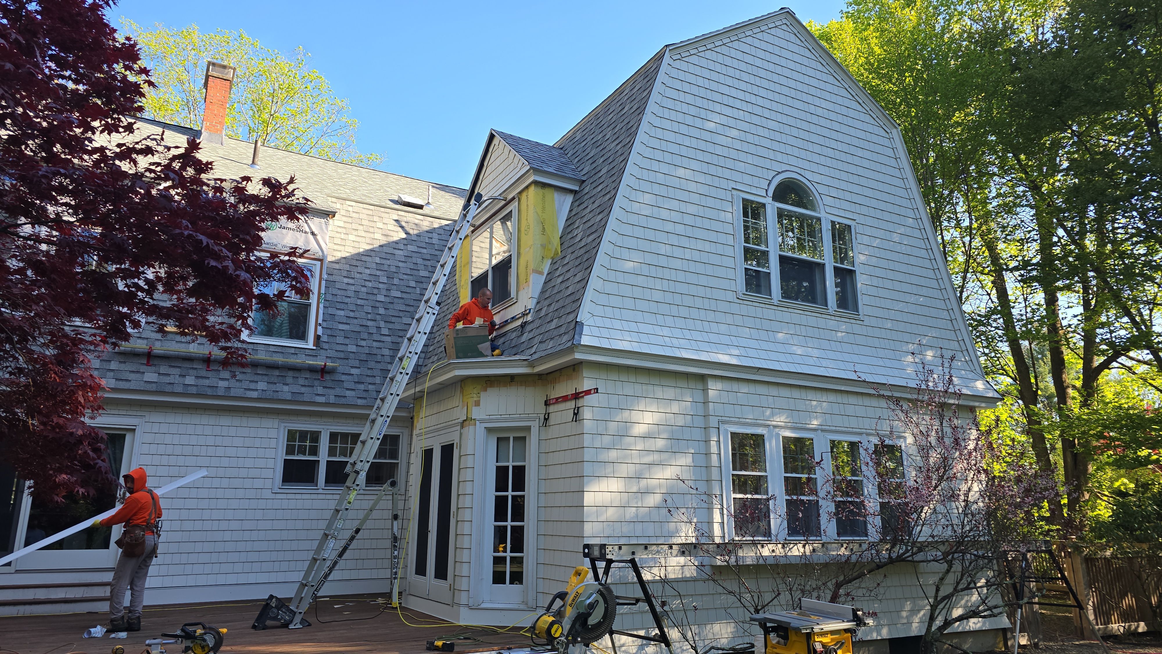 White cedar shingles and windows in Wayland, MA by UBrothers Construction