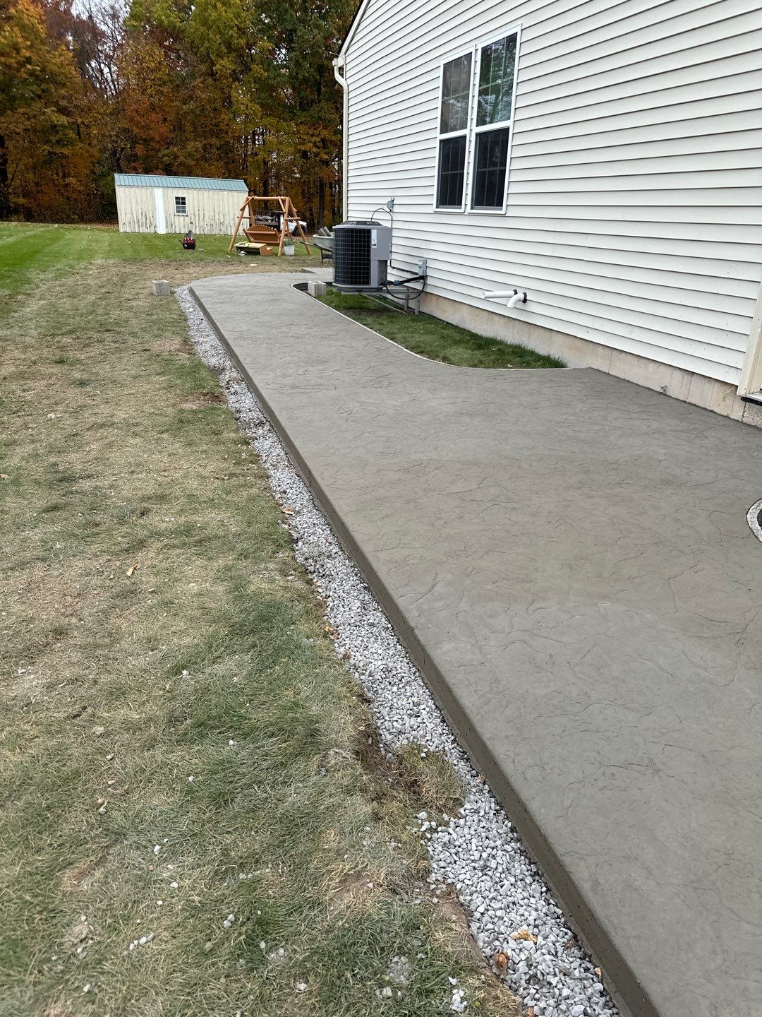 Oxford Slate stamped concrete patio  by NG Masonry & Construction LLC