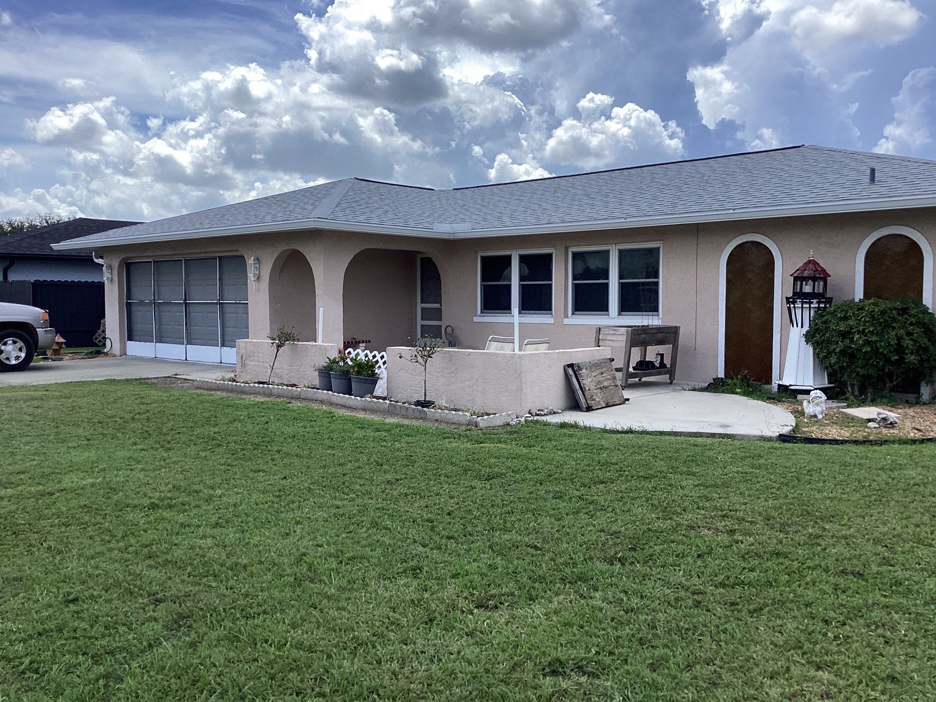 White Seamless Gutters and Splash Guards in Fort Myers FL by Gutter Professor by Gutter Professors