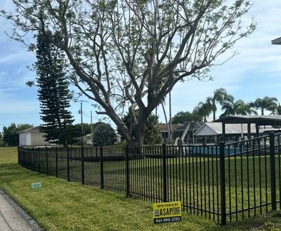 Aluminum Fence Installation using Black 3 Rail Aluminum and Vinyl Privacy Fence