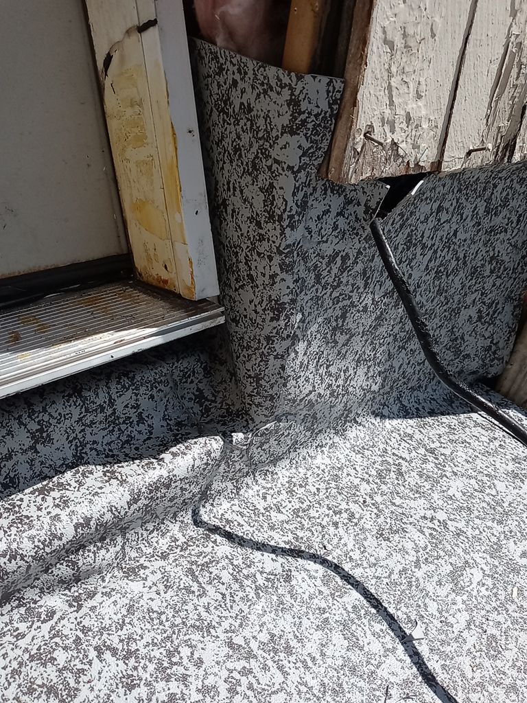 Residential Roofing Installation, Dec-tek walk-out porch roof, siding on garage by Absolute Roofing and Construction