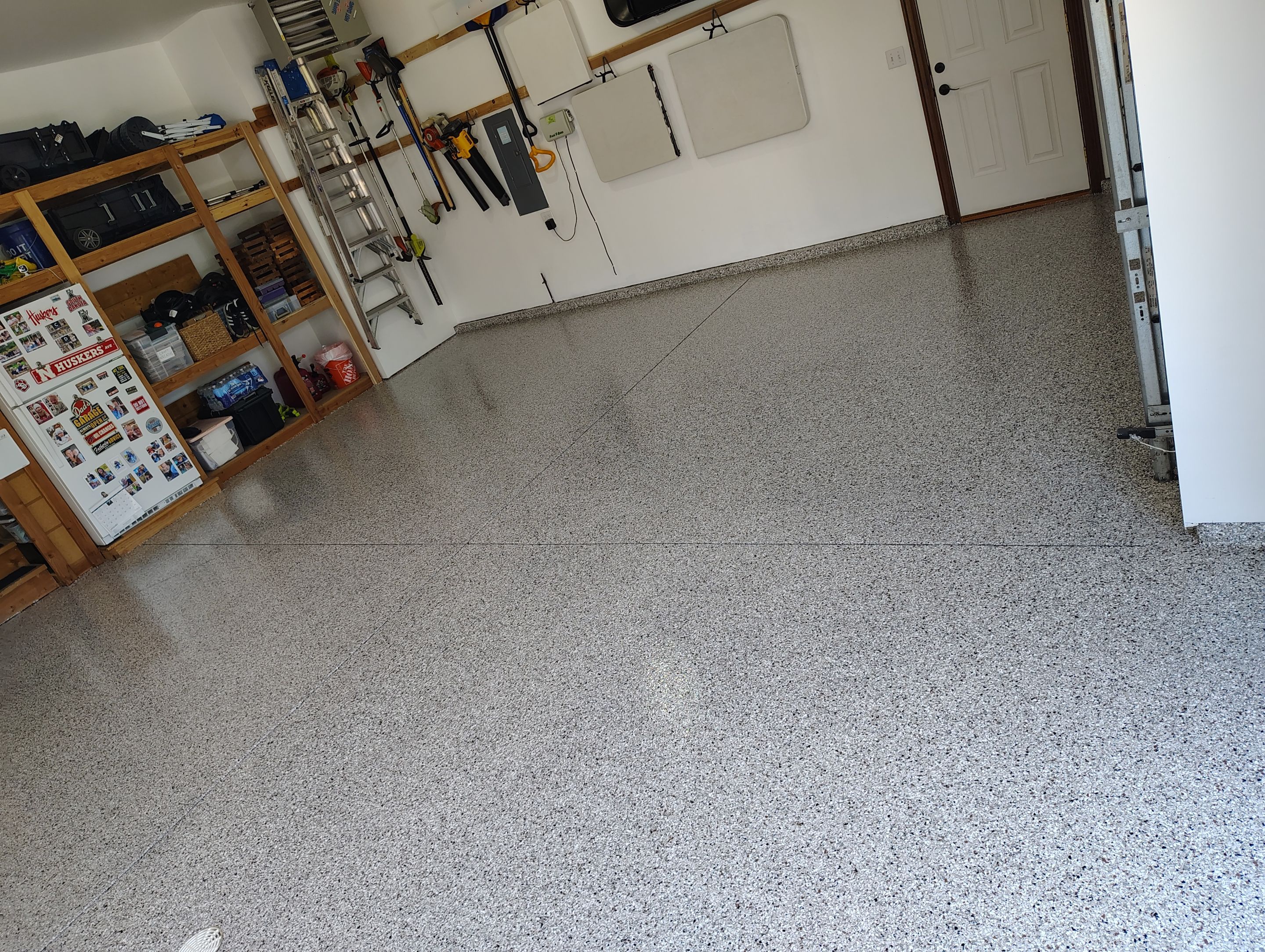 Coyote Garage Floor Coating in Sioux Falls by Select Painting, Coatings & Garage Cabinets