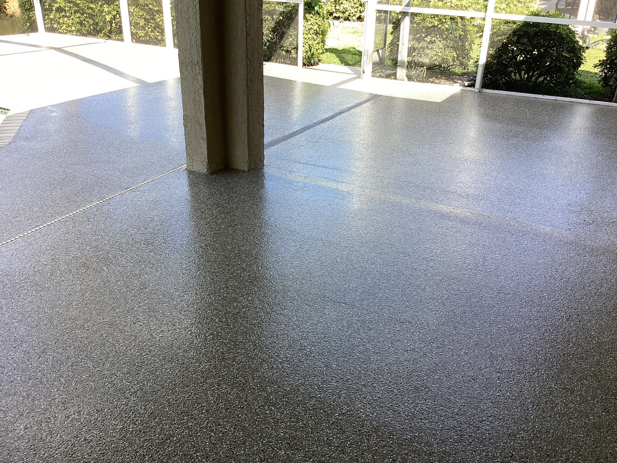 Patio using Pebble Beach by Amvet concrete coatings llc