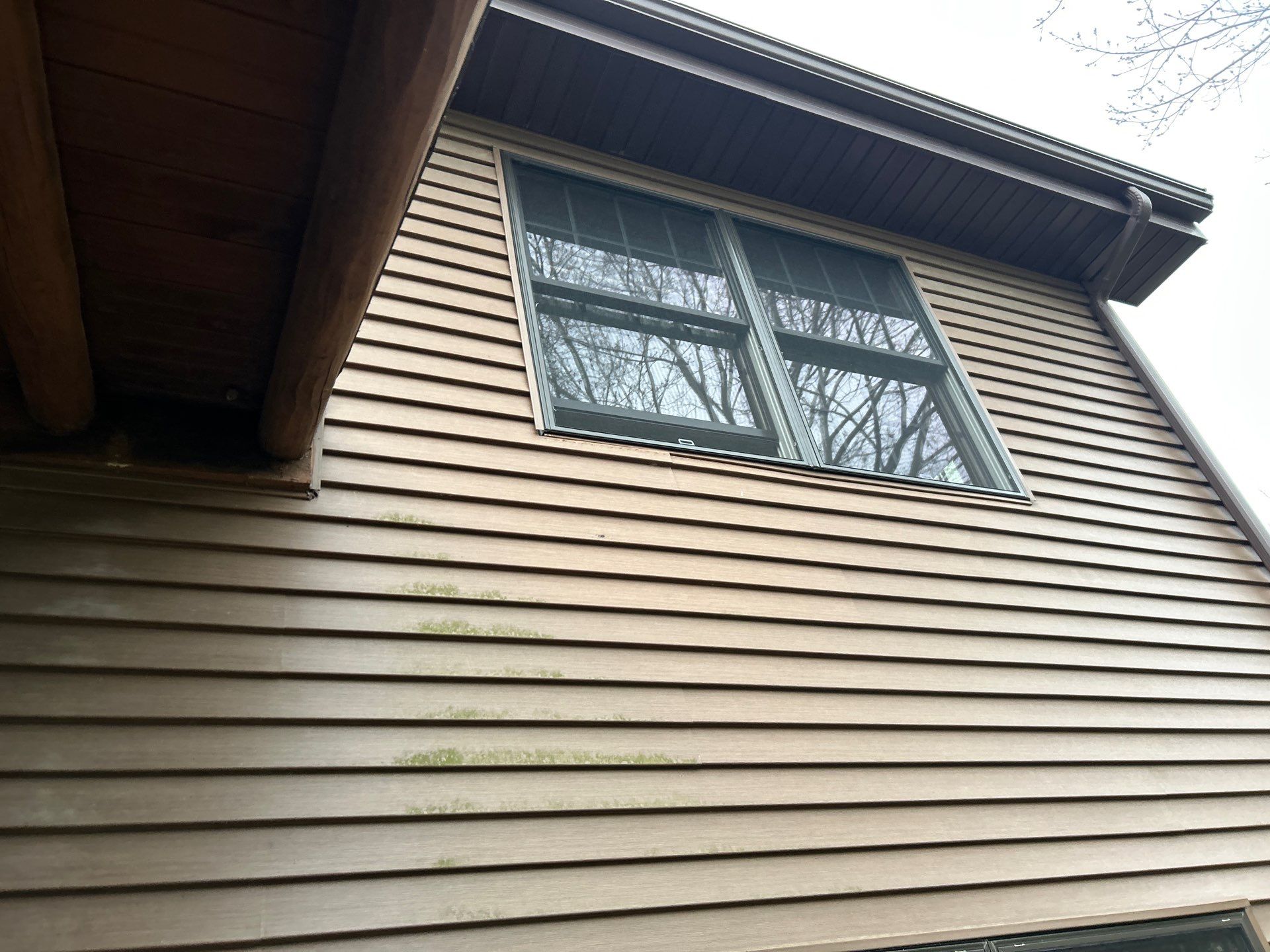 Pella Window installation using Pella Lifestyle wood/Aluminum window by United Windows and Siding LLC