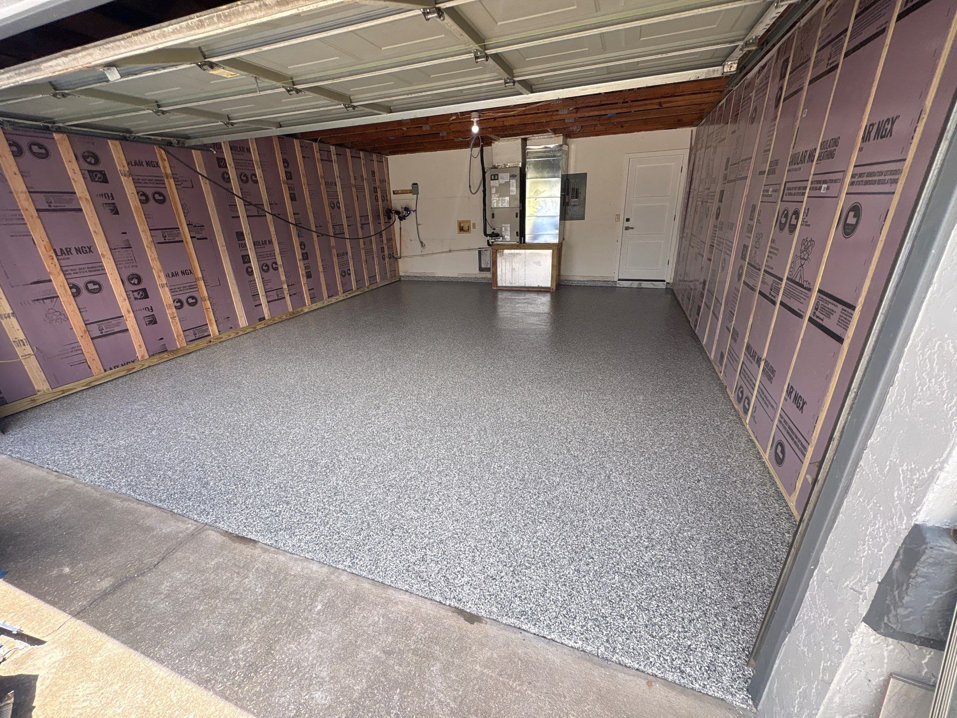 Gravel Flake Epoxy Garage Floor Installation in Brandon, Florida by Performance Floors & Coating