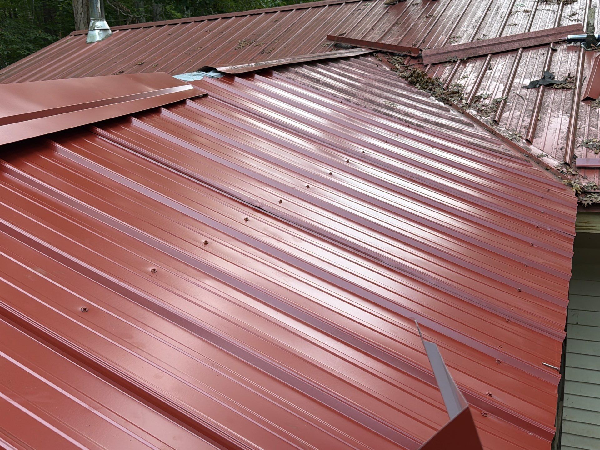 Red Metal Roof Restoration and Wood Fascia Replacement in Barboursville by Cade Construction