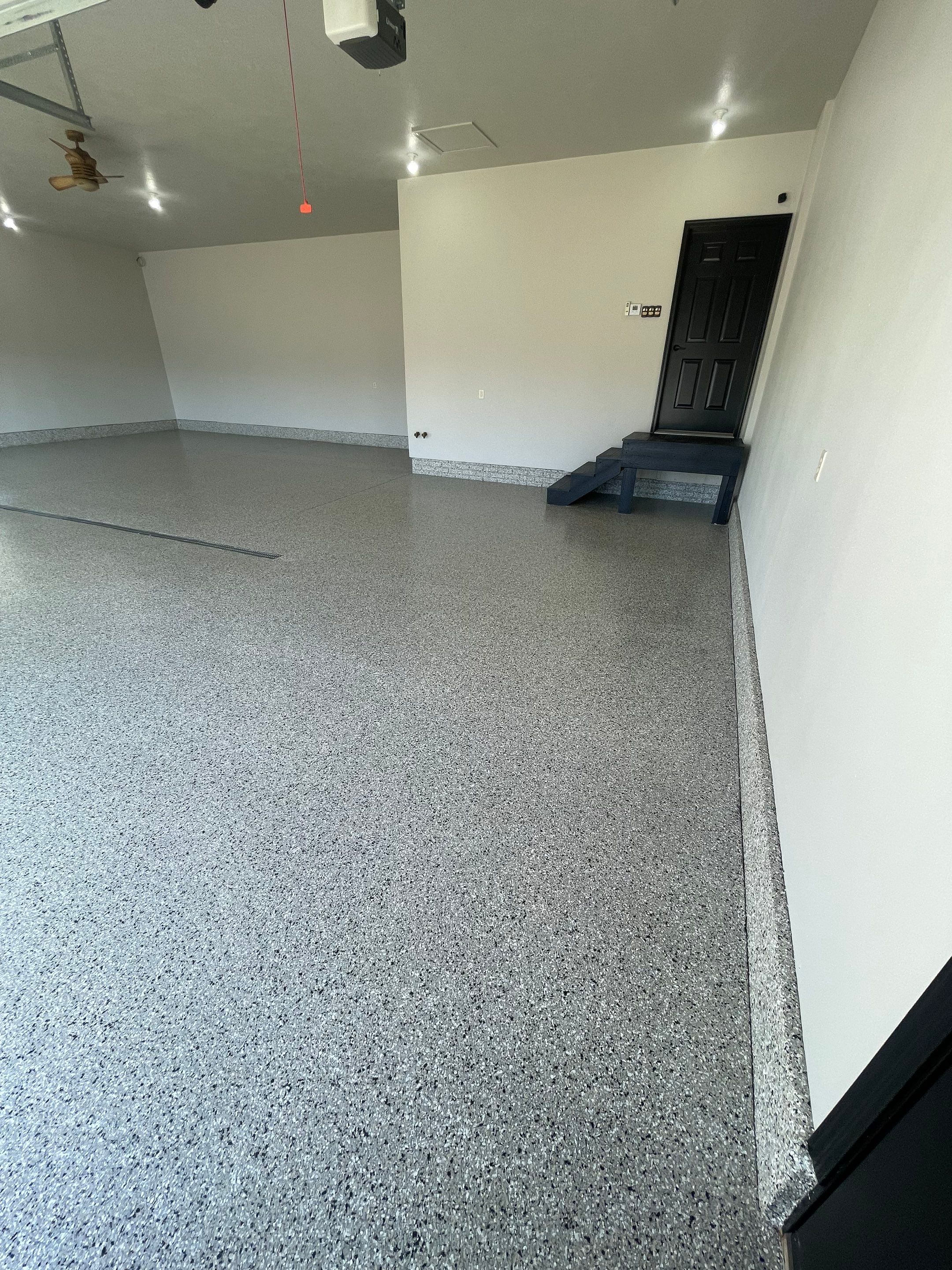 Multi-Car Garage Epoxy Floor Coating in Beresford by Select Painting, Coatings & Garage Cabinets