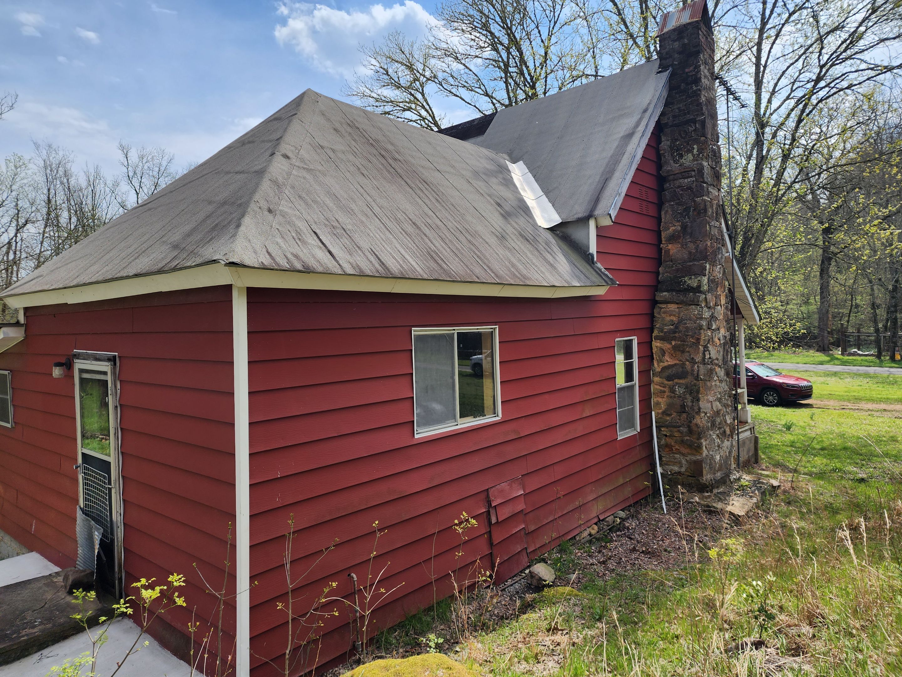 Residential Roofing Installation using 26 Gauge Colored Panels by Hostetler Roofing